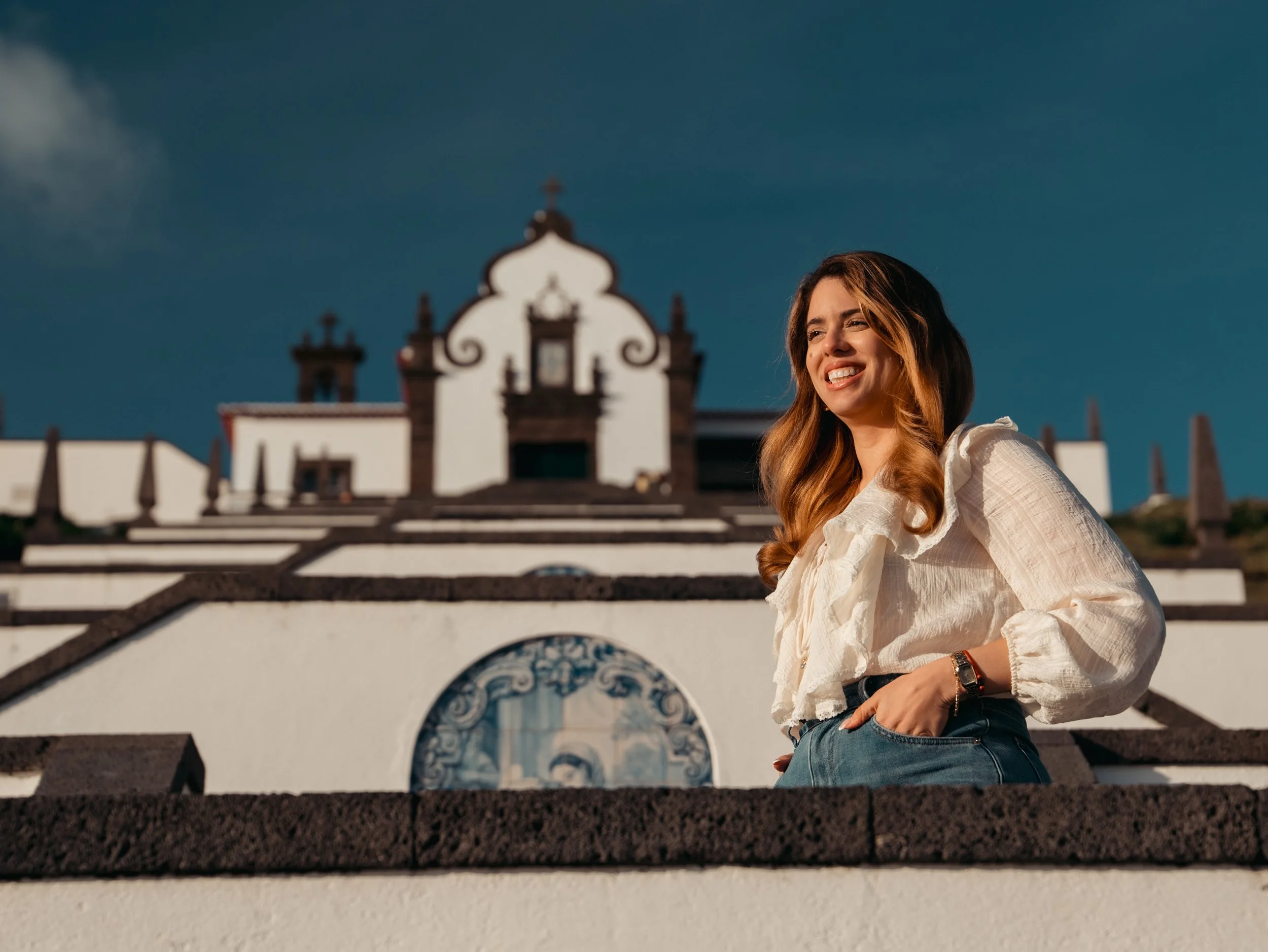 Solo traveler photographed in front of a historic church in São Miguel Island, Azores during a private photo tour with a local Azores photographer