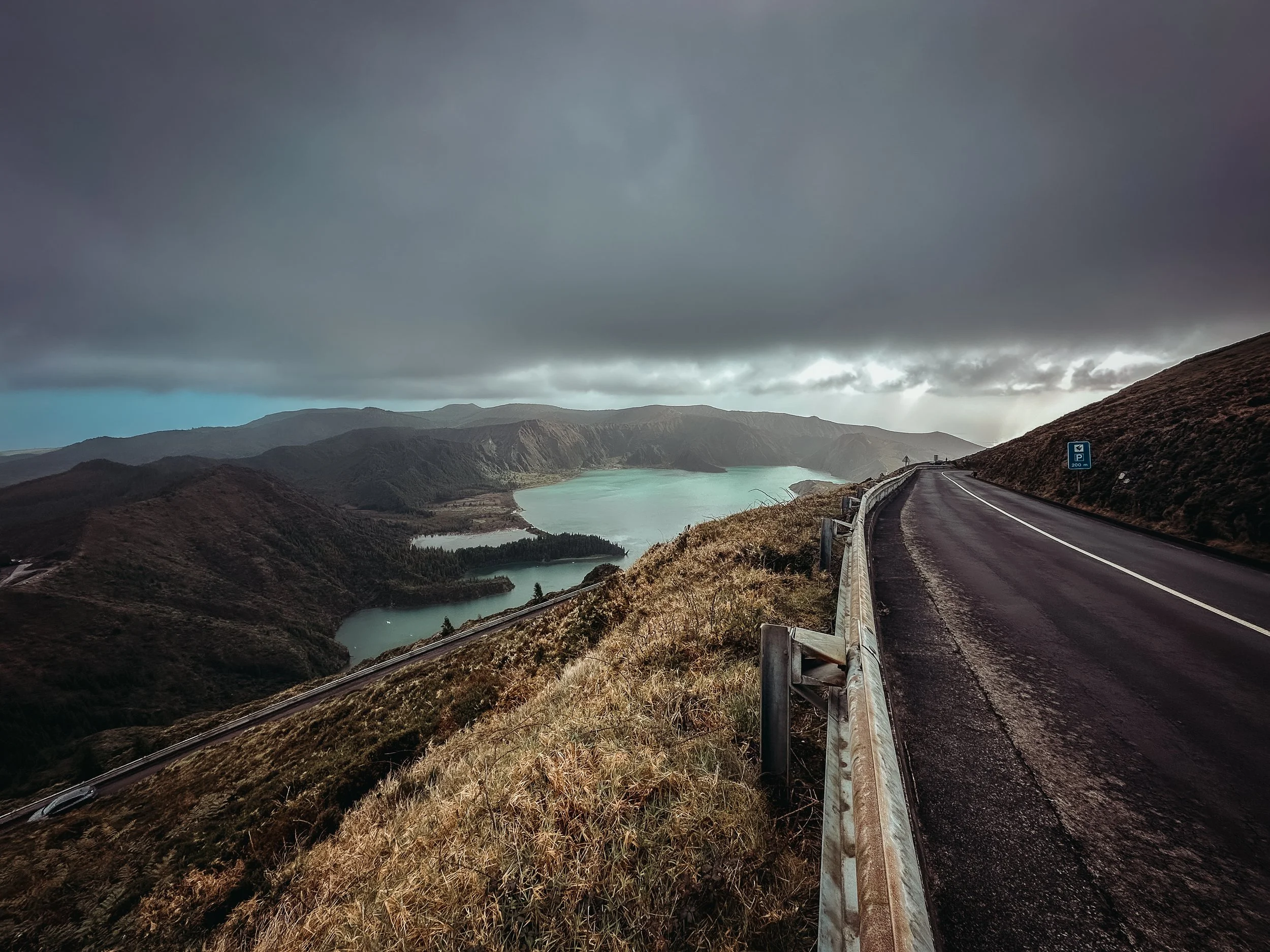 Dramatic landscape view of Lagoa do Fogo volcanic lake from a mountain road in São Miguel, Azores