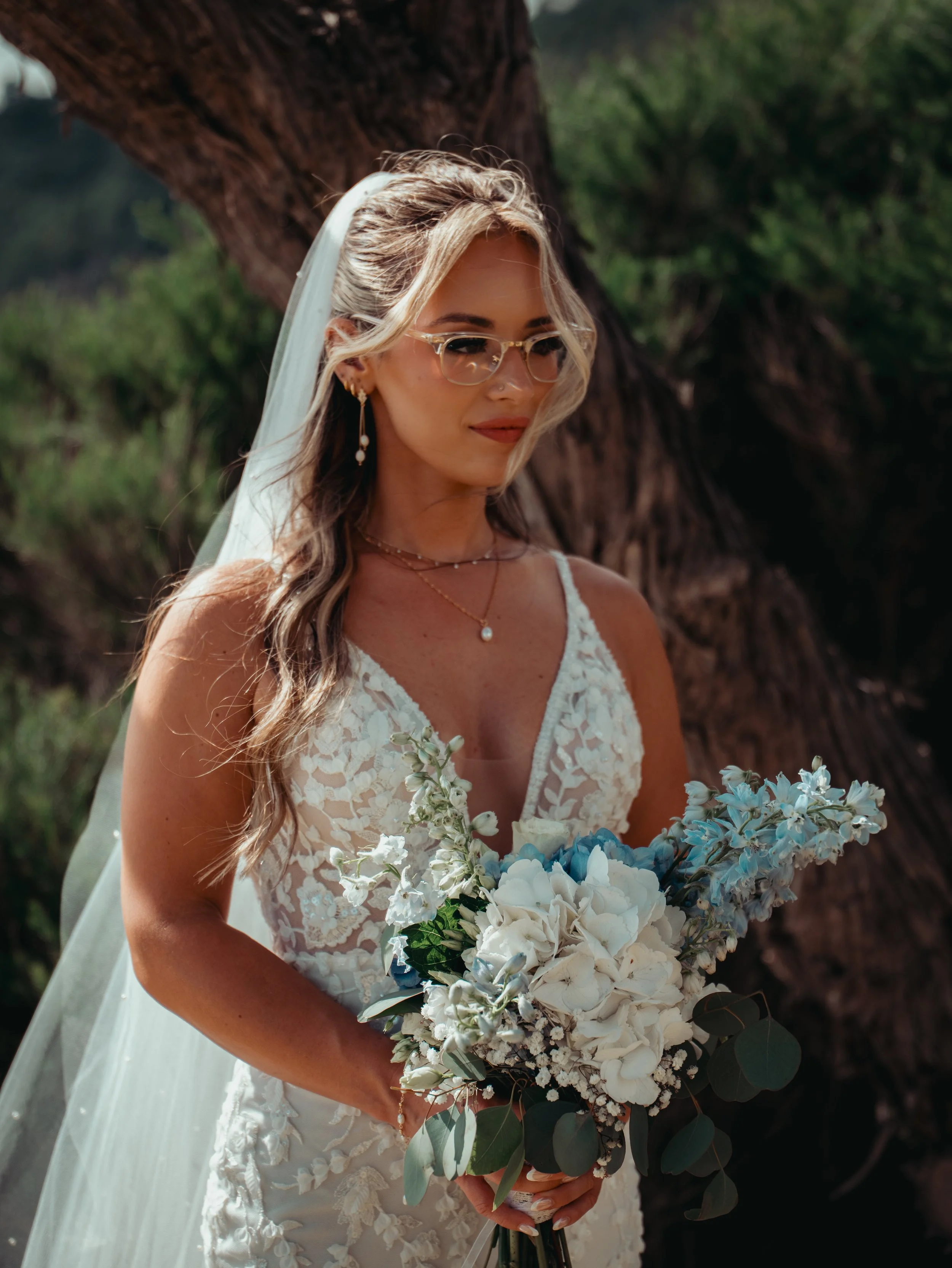 Azores elopement bride holding bouquet in São Miguel with natural light and green landscape