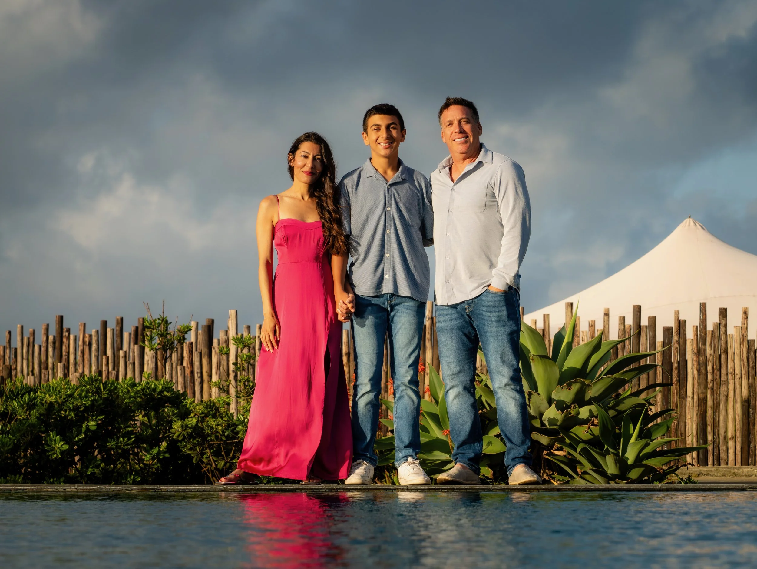 Family enjoying a private tour in São Miguel, Azores, during a relaxed outdoor photo session near a luxury accommodation