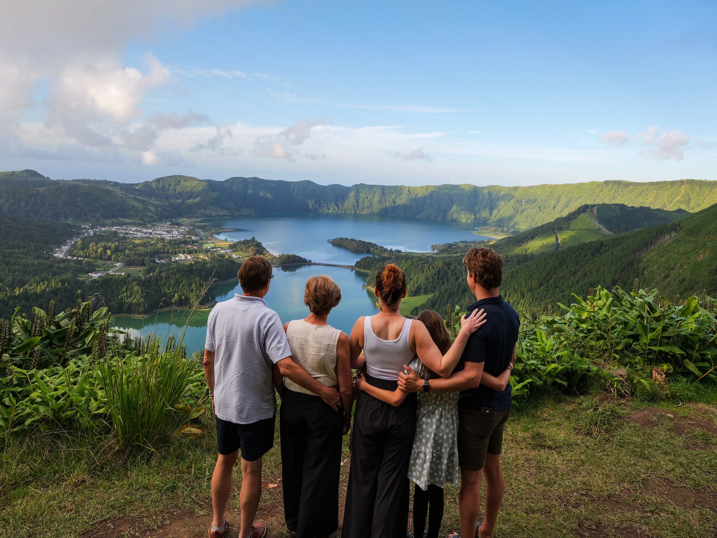 Family enjoying a private full-day photo tour in São Miguel Island, Azores, with a professional vacation photographer and local guide.