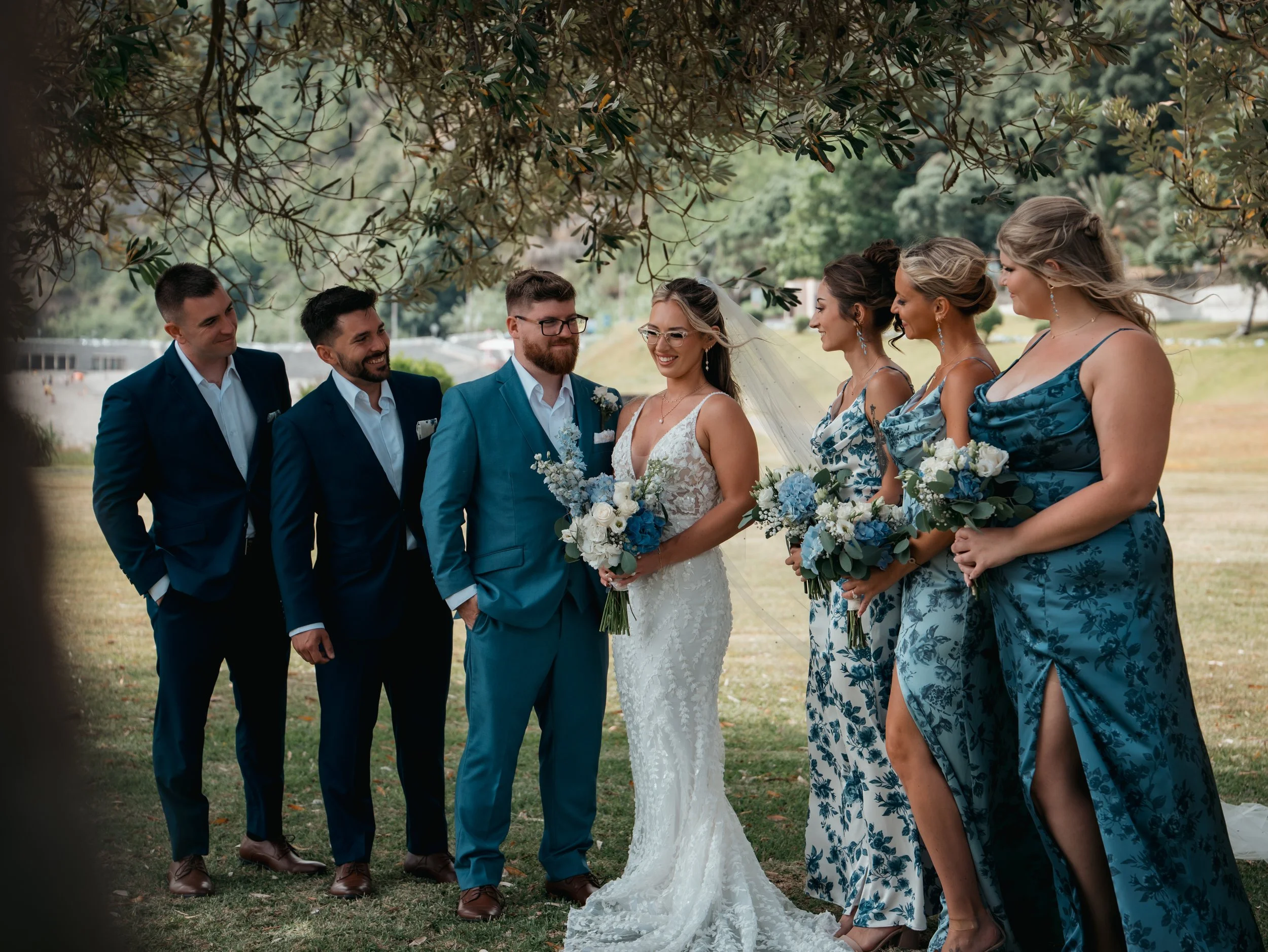 Wedding group during an intimate elopement in São Miguel, Azores, with bride, groom and close family and friends celebrating outdoors
