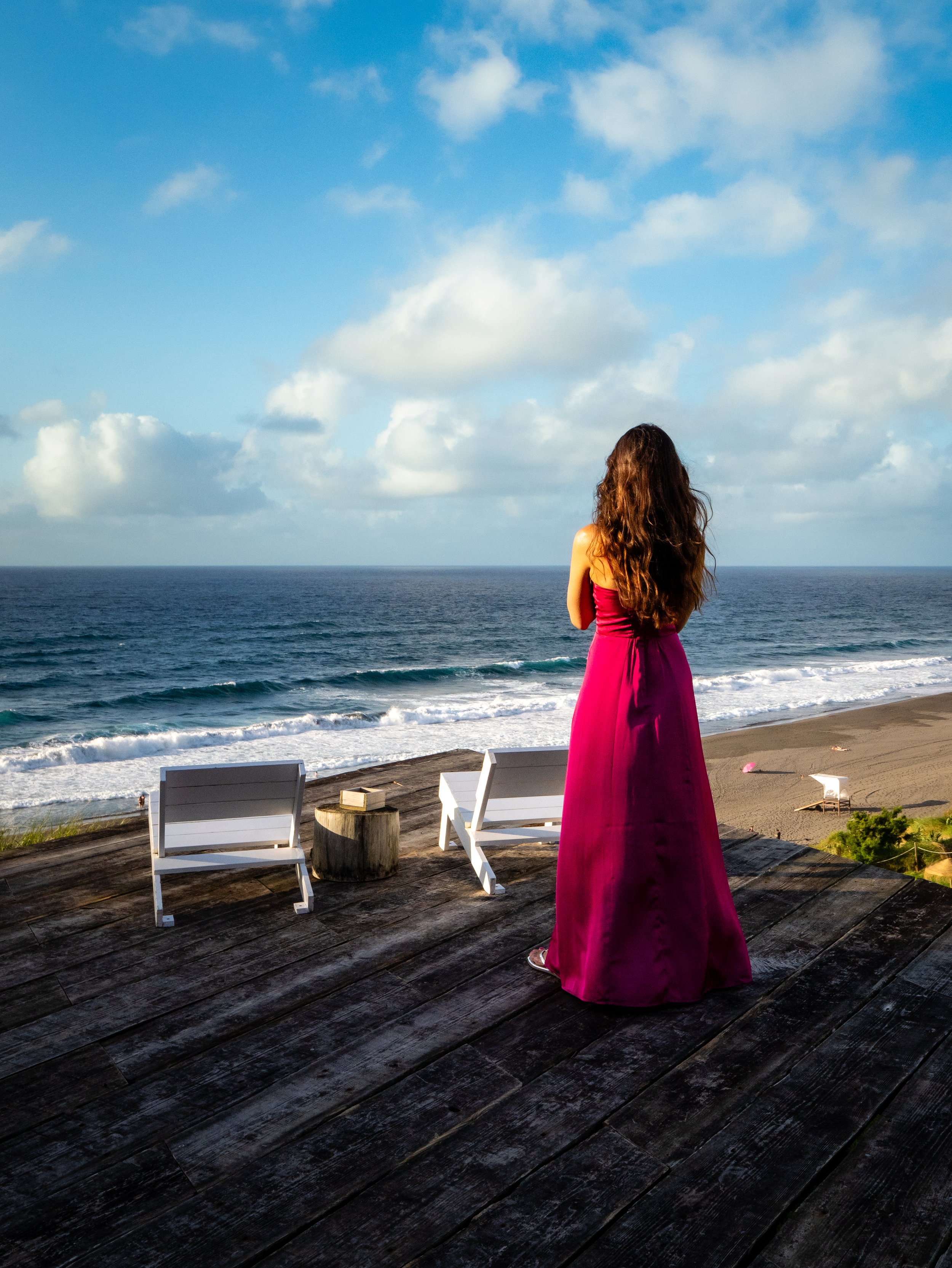 Woman looking at ocean during Azores photo tour in São Miguel Island scenic viewpoint