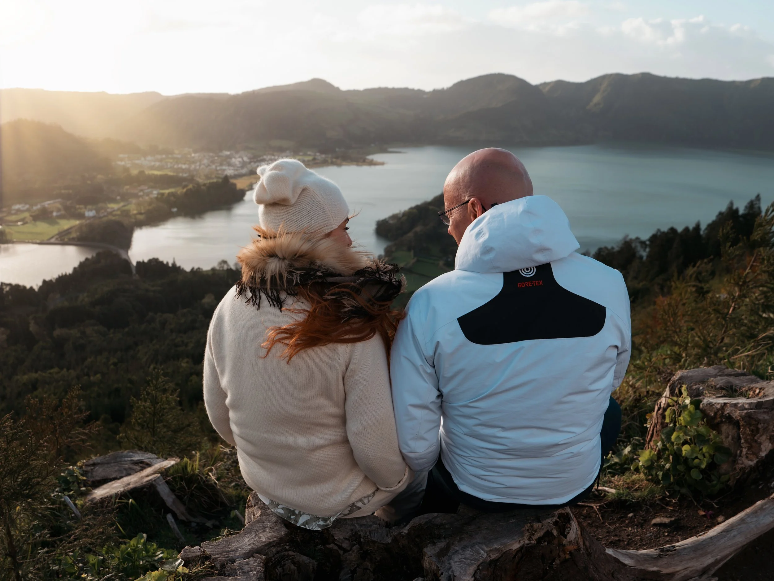 Couple enjoying sunset view over Sete Cidades lake in São Miguel, Azores during a private photo tour