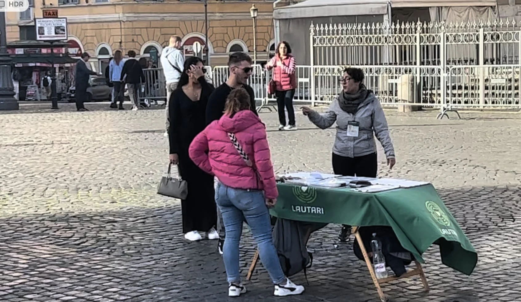 A petition table in a Rome piazza, part of the three yes petition scam