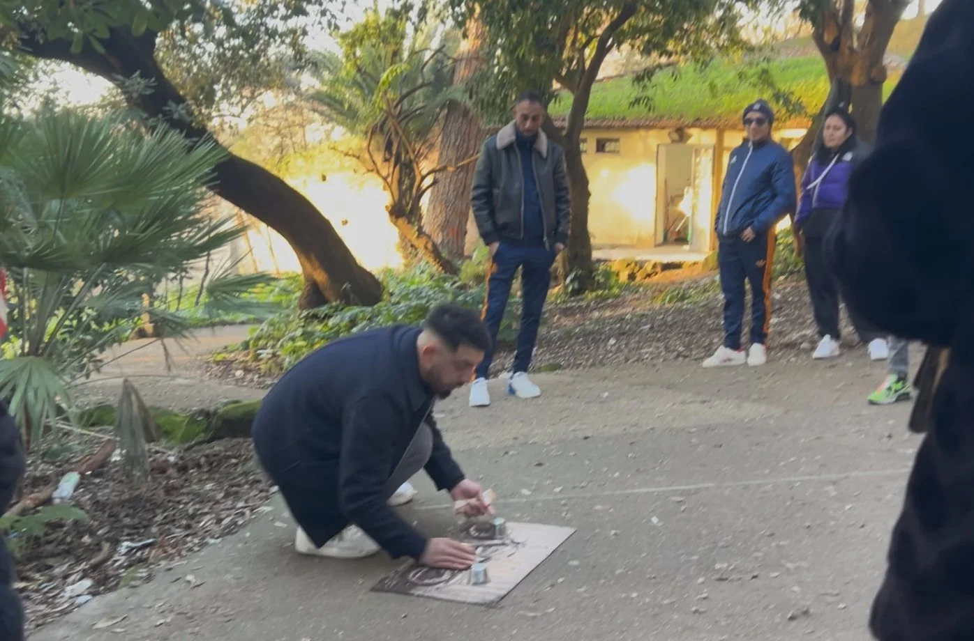 The three cup shell game scam in a Rome park