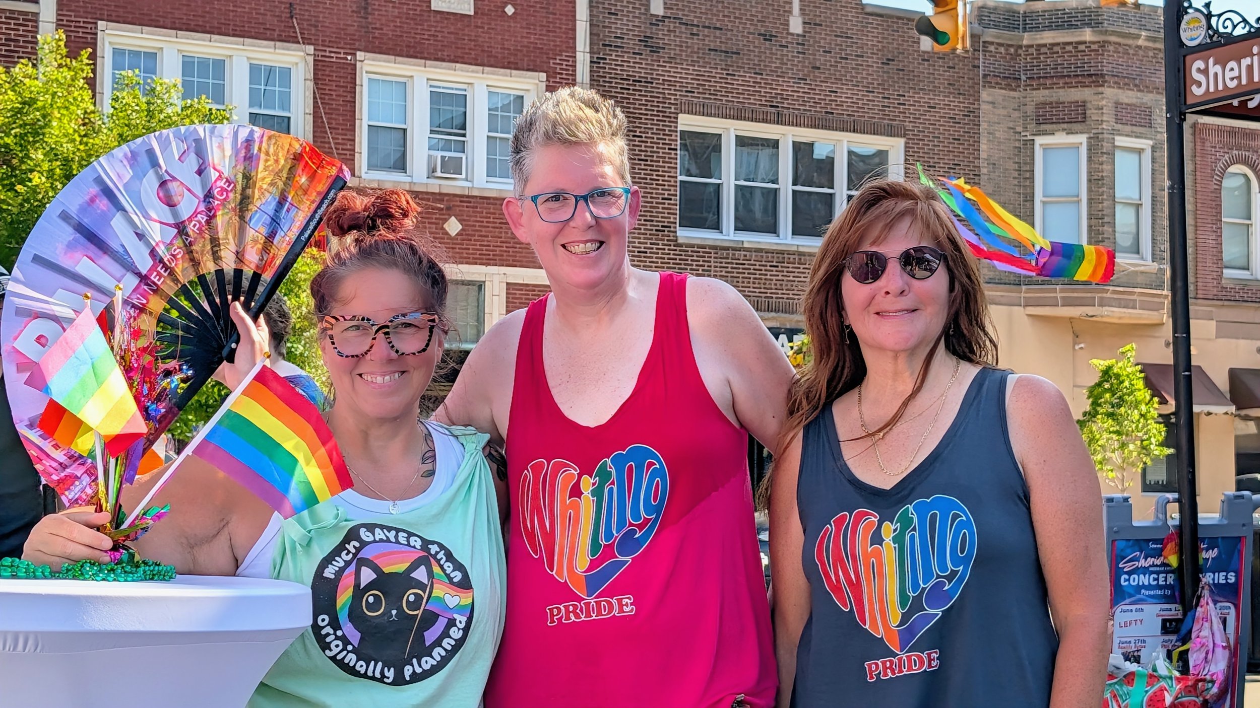 a red cooler with an orange sign with "Free Water!" taped to it with rainbow tape
