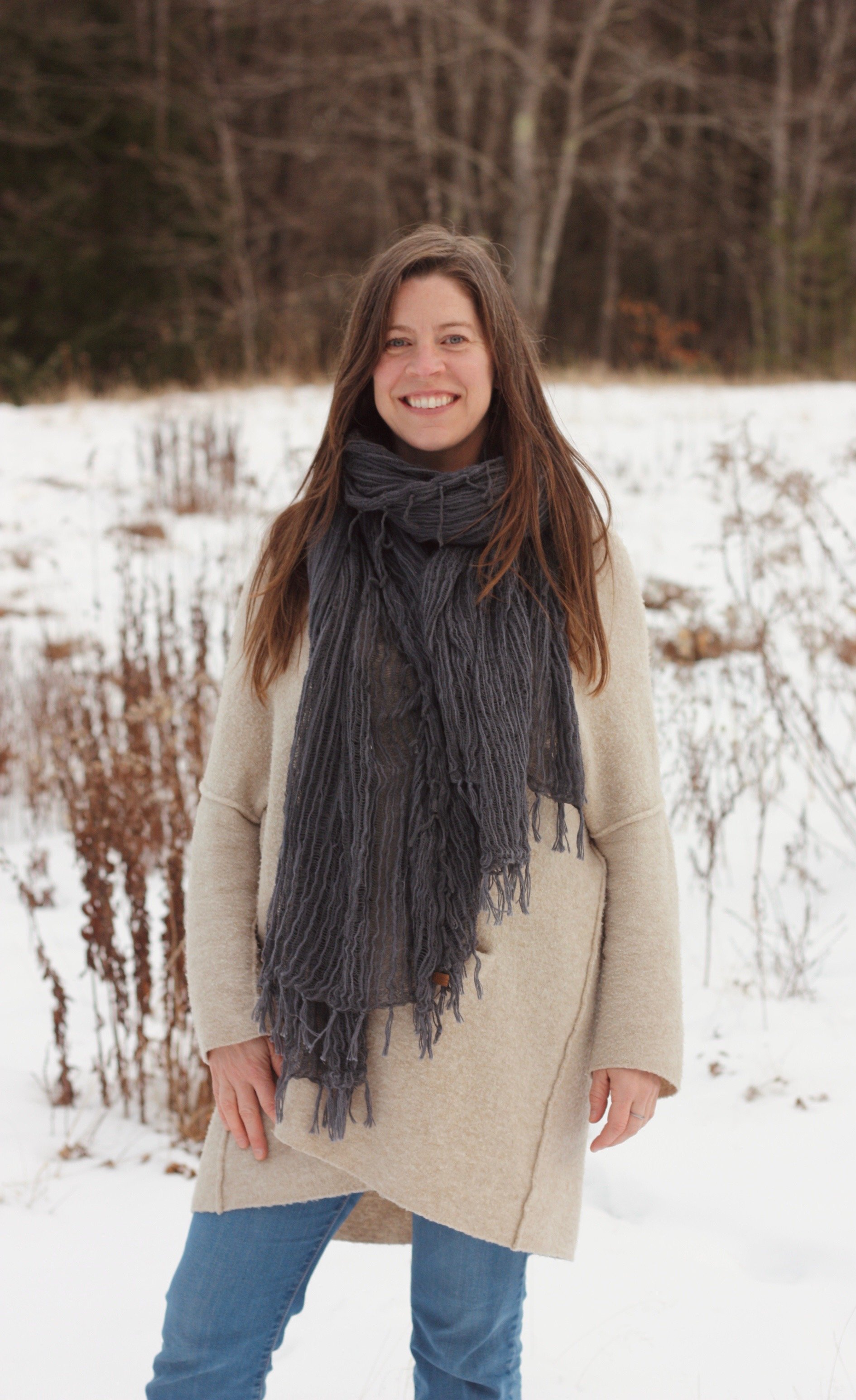 Hannah James RN standing in a field