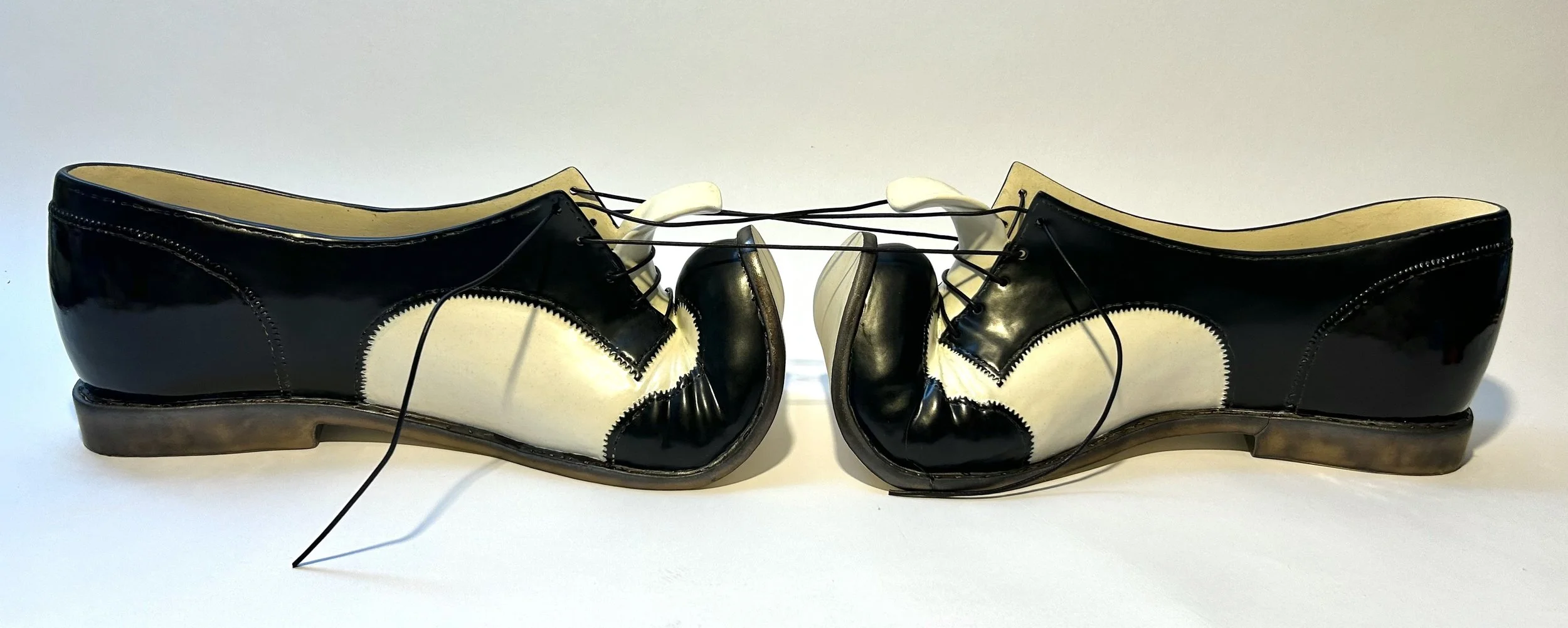 Carmen Lang, Foothold, 2026, Stoneware and leather, 6 x 29 x 6.5 in