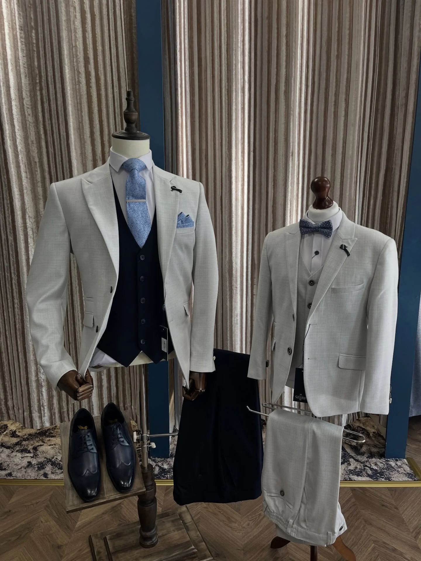 Double the style.

Our matching light suits styled two ways &mdash;
&bull; Navy waistcoat &amp; tie for a bold, modern look
&bull; Classic bow tie for a clean, timeless finish

Perfect for weddings, communions, and standout moments.

Available in-sto