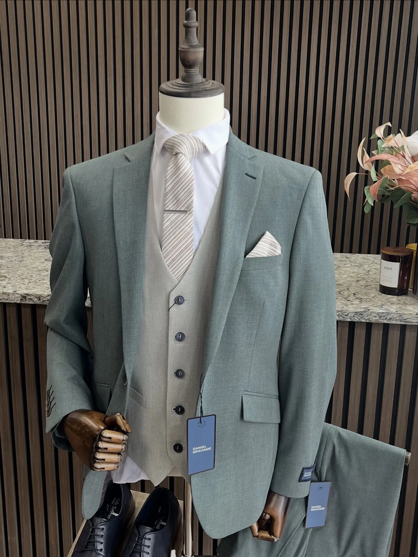 Summer suits don&rsquo;t need to be boring.

This sage green piece from Daniel Graham is elevated with a light grey waistcoat, keeping the look fresh and breathable for warmer days.

We&rsquo;ve paired it with navy shoes to add a bit of depth &mdash;