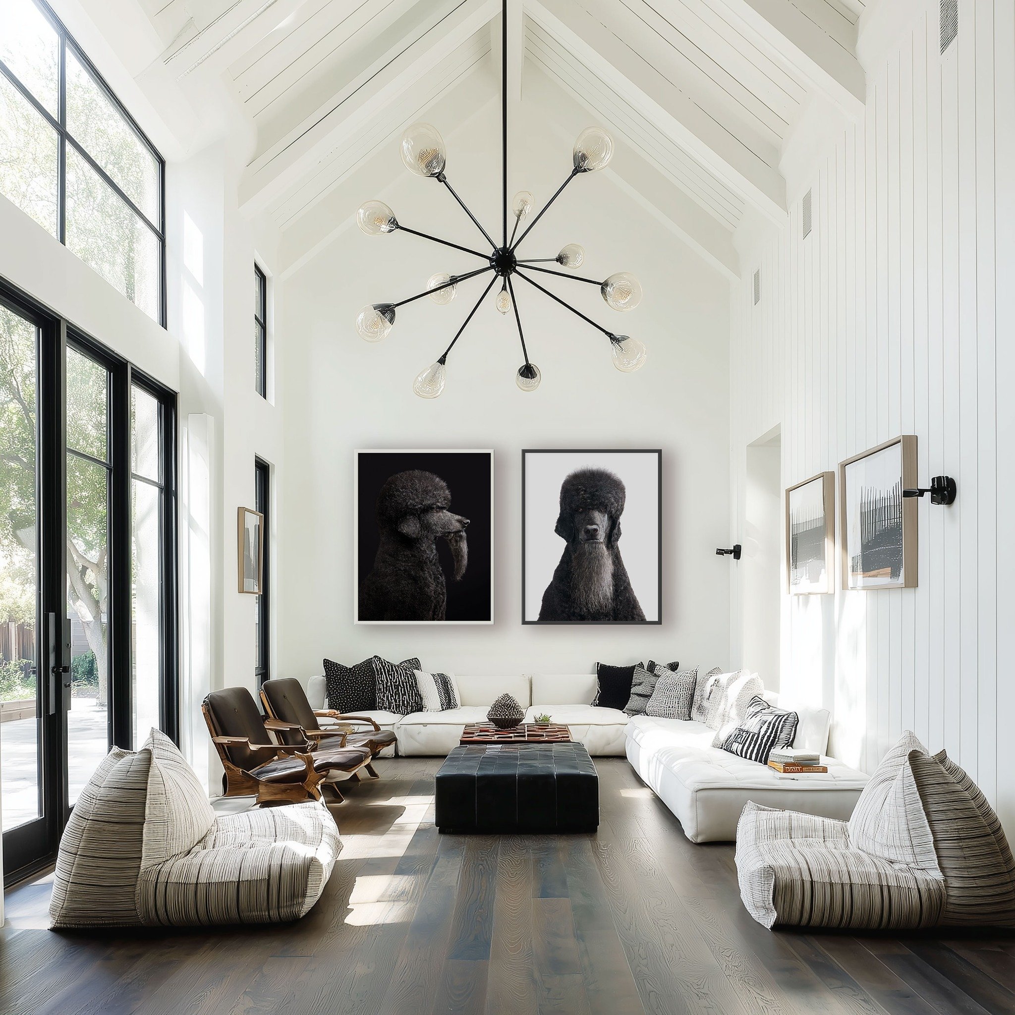 Two CeeLo poodle portraits by Randal Ford displayed together above a sofa in a bright game room