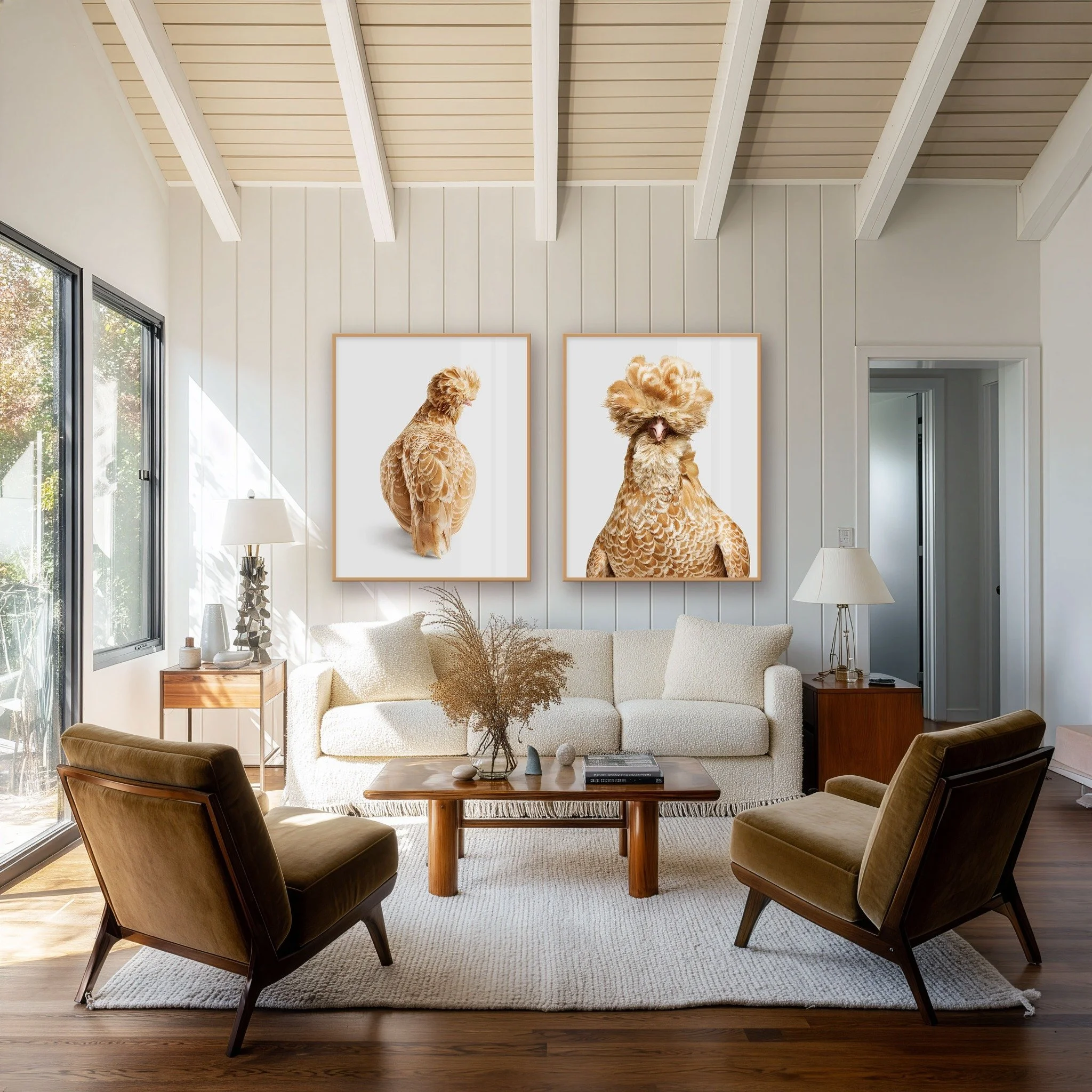 Two buff laced Polish hen portraits by Randal Ford displayed side by side above a living room sofa