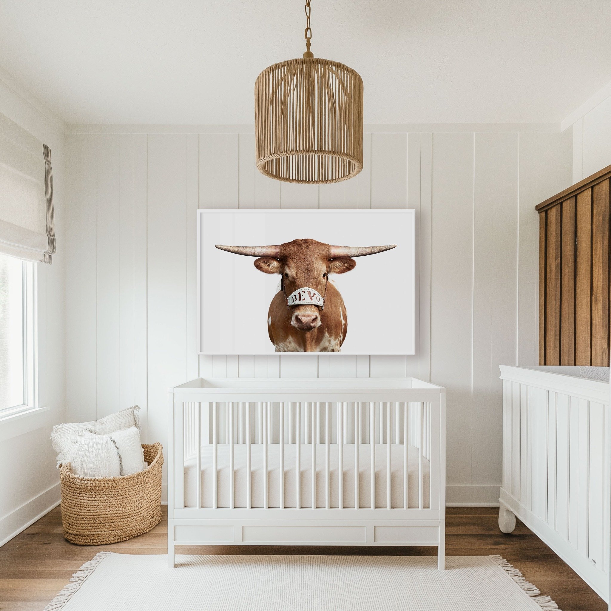 Bevo XV calf portrait by Randal Ford displayed above a crib in a bright nursery