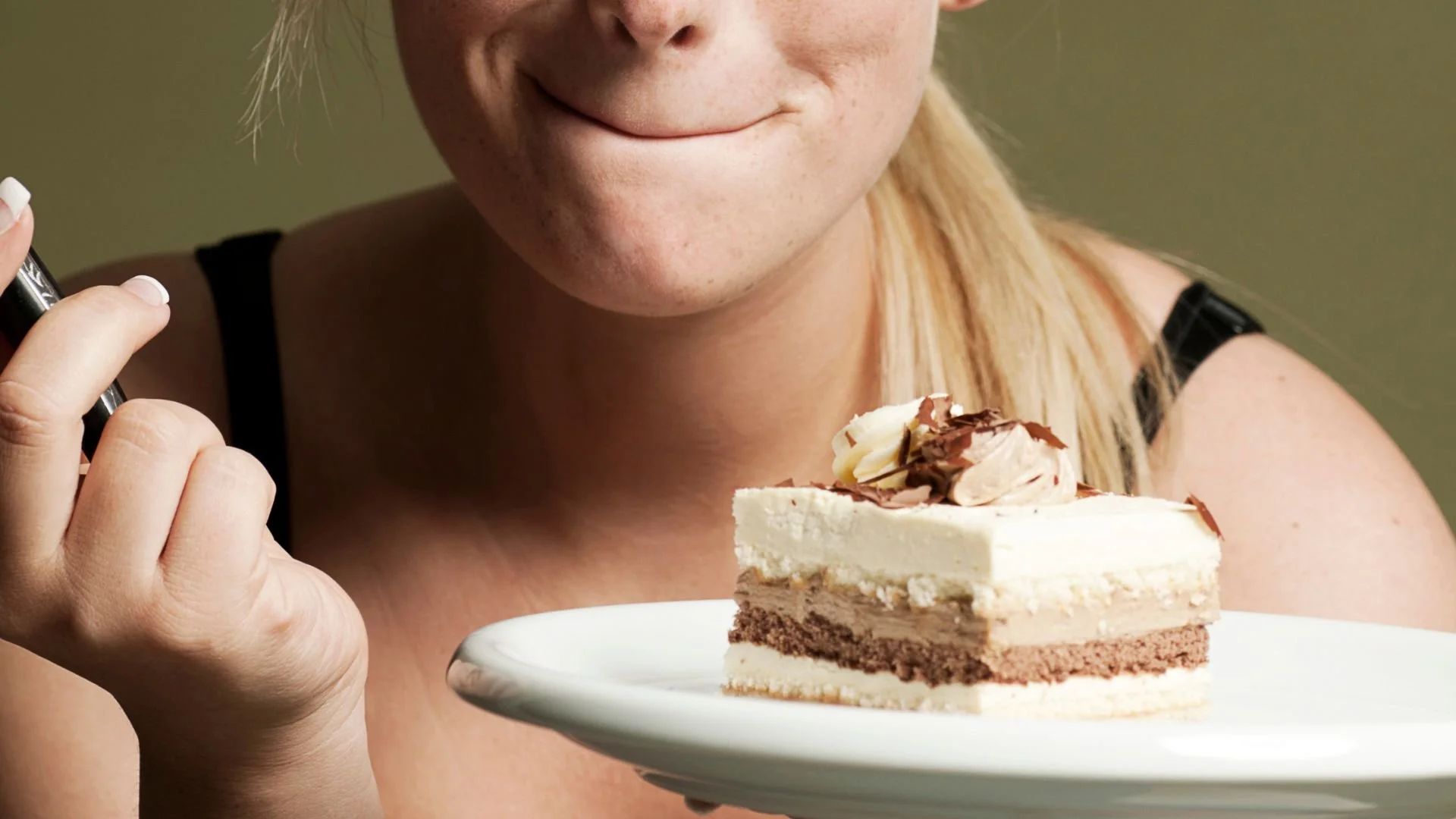 The Traveling Saleslady Woman smiing about to eat cake celebrating big win