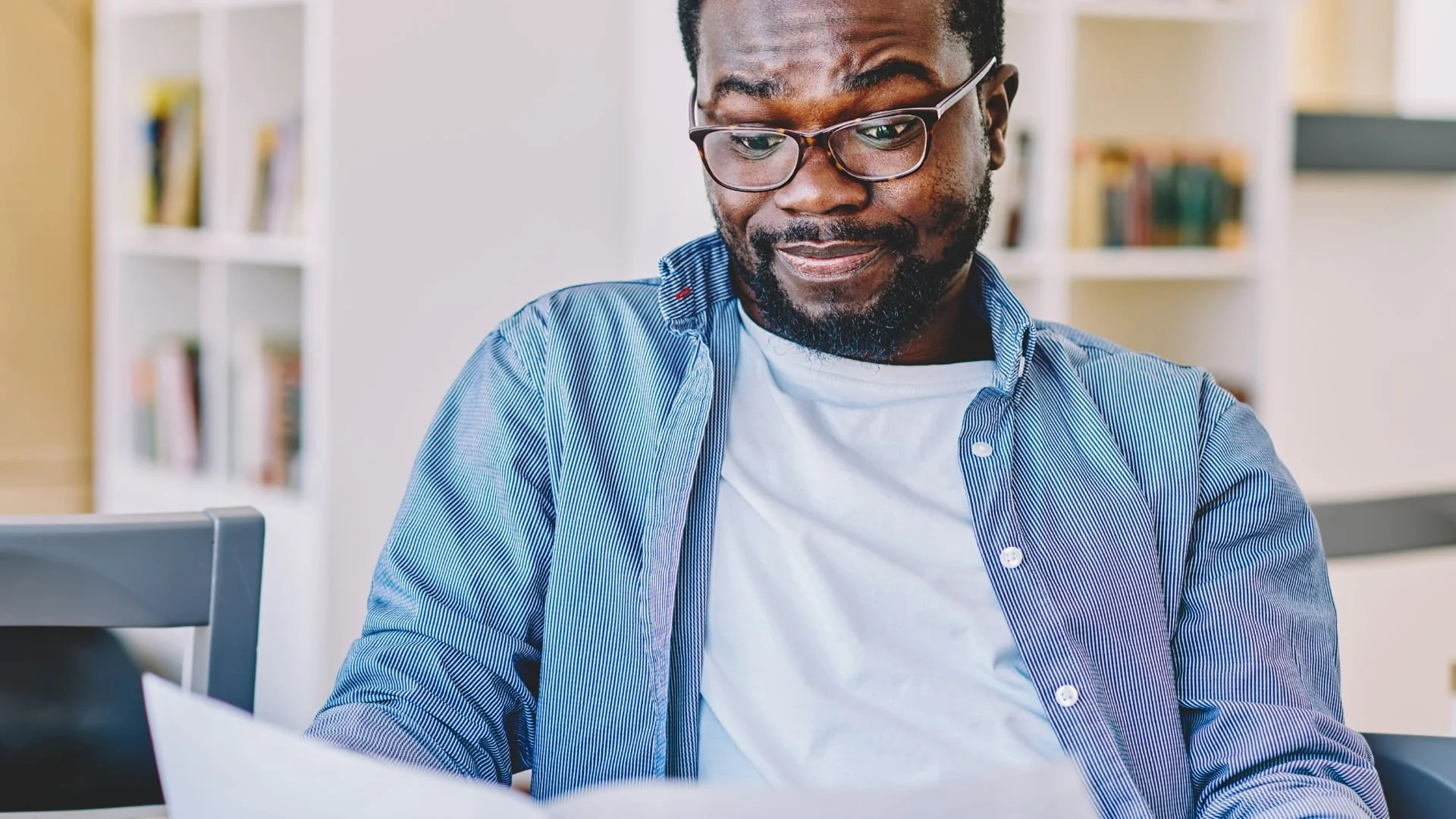 Skeptical man looking down at a document