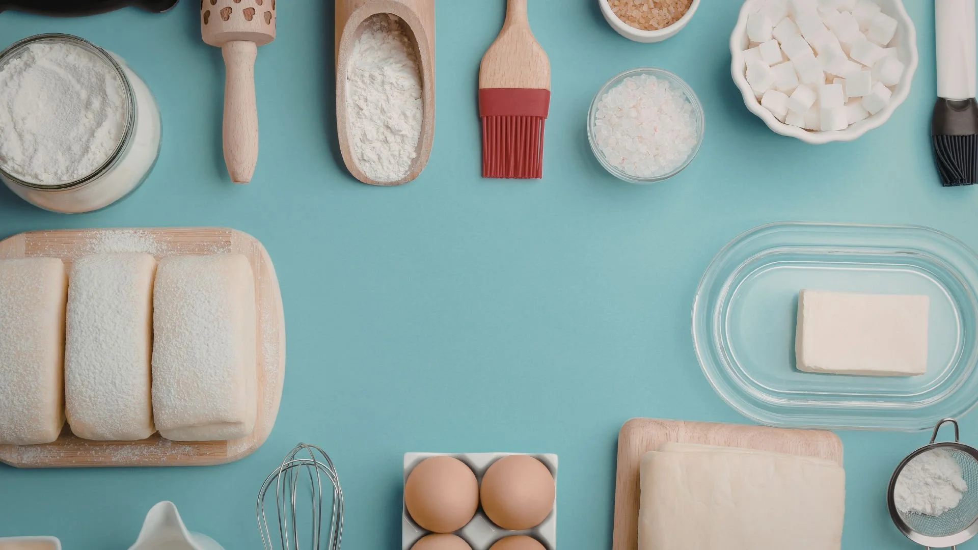 The Traveling Saleslady Baking Ingredients organized on a blue clean table
