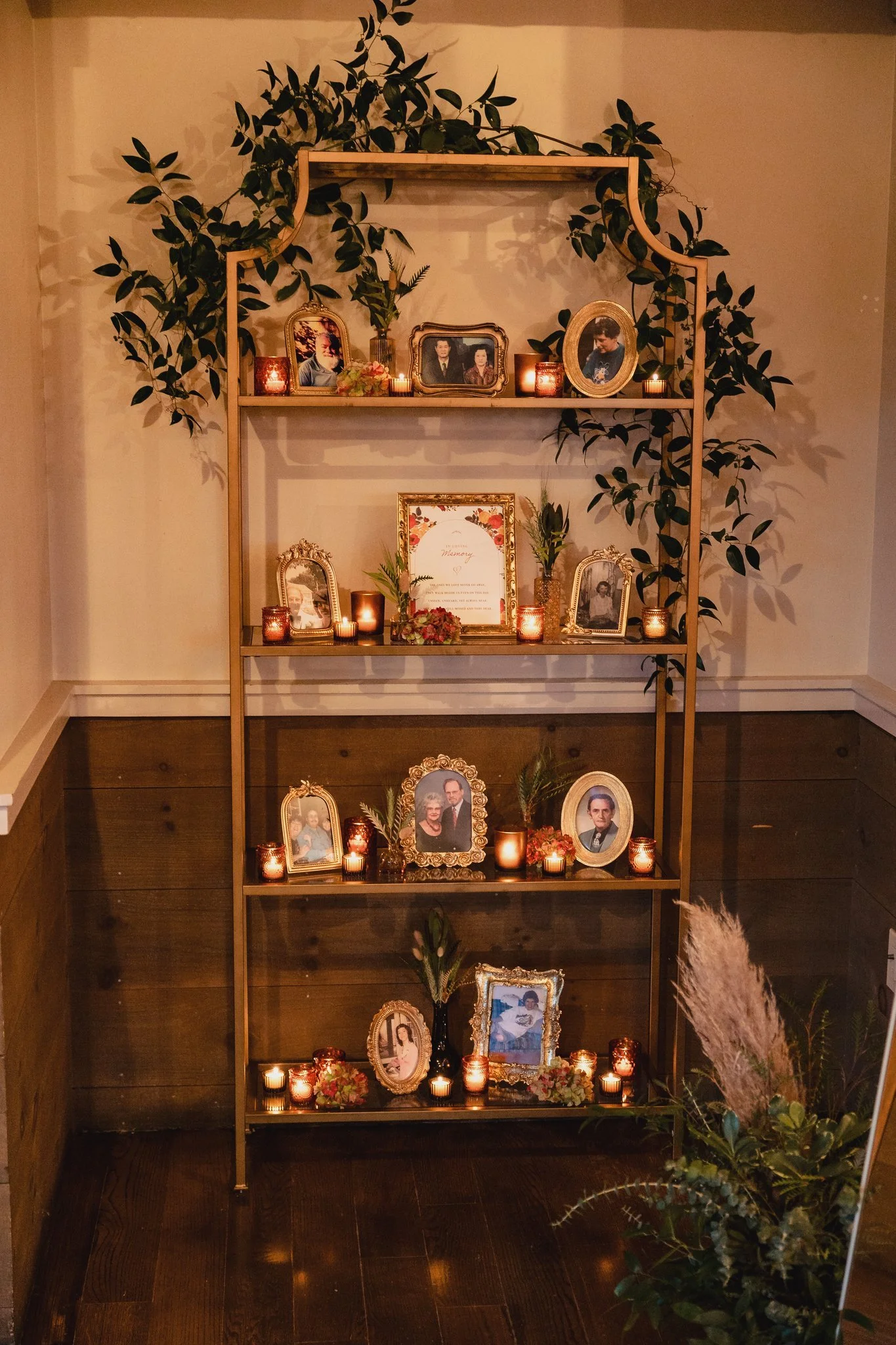 Tall gold shelving unit with glass shelves. Dimensions are 80” H x 36” W x 12” D QTY 2 Photo by GarrenTee