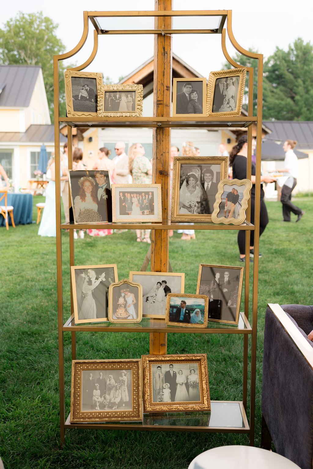 Tall gold shelving unit with glass shelves. Dimensions are 80” H x 36” W x 12” D QTY 2 Photo by Lillian Seibert