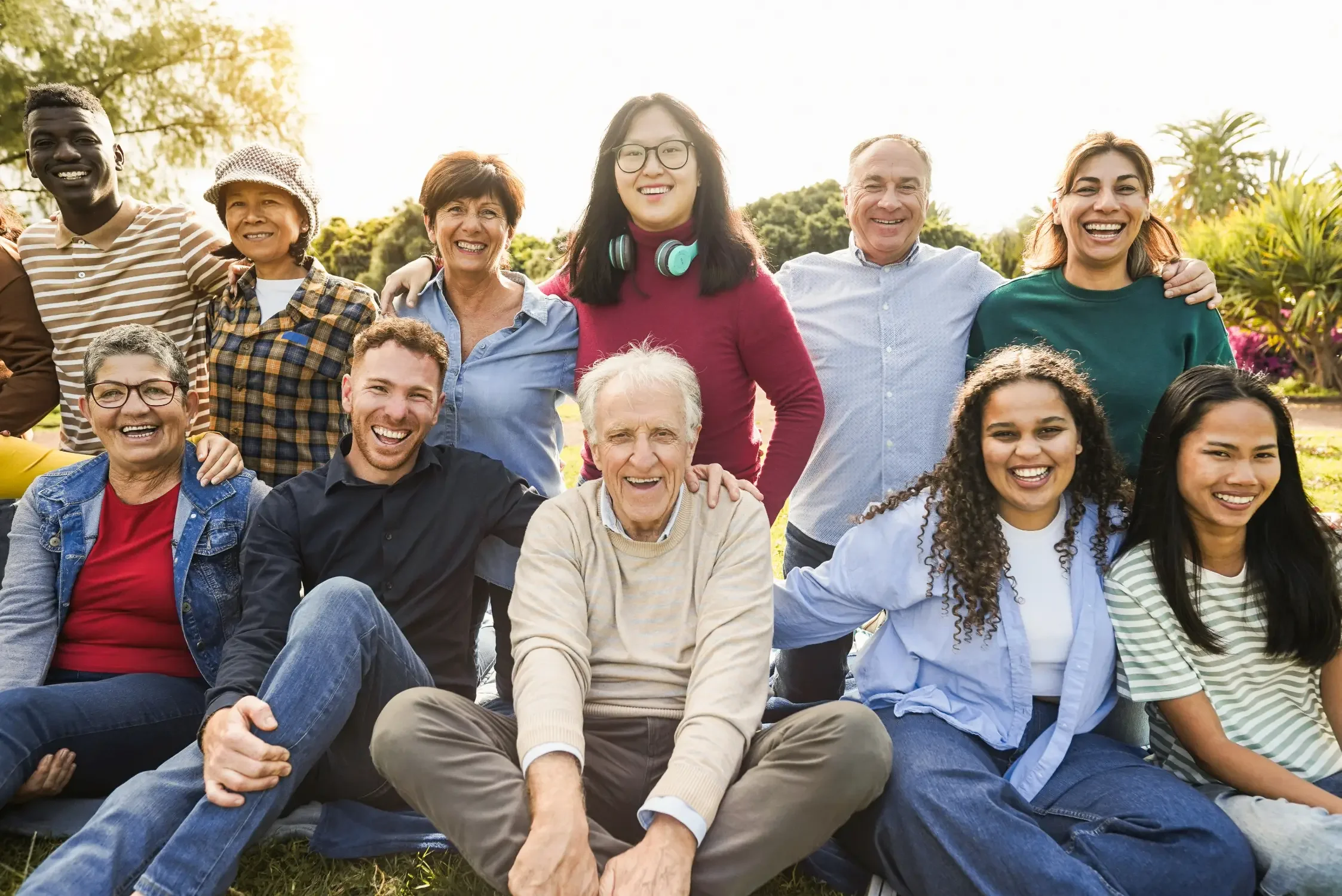 a group of people of all ages smiling at the camera