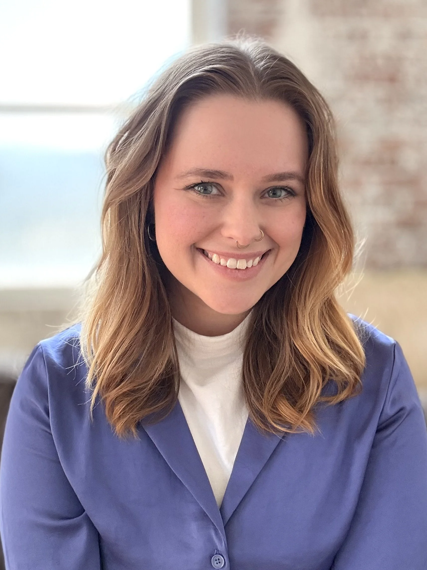 an image of Juno VanWeelden smiling at the camera