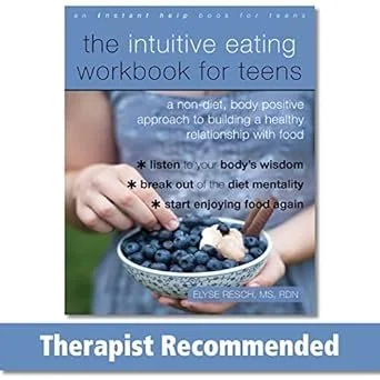 a young adult picking out blueberries from a small blue bowl