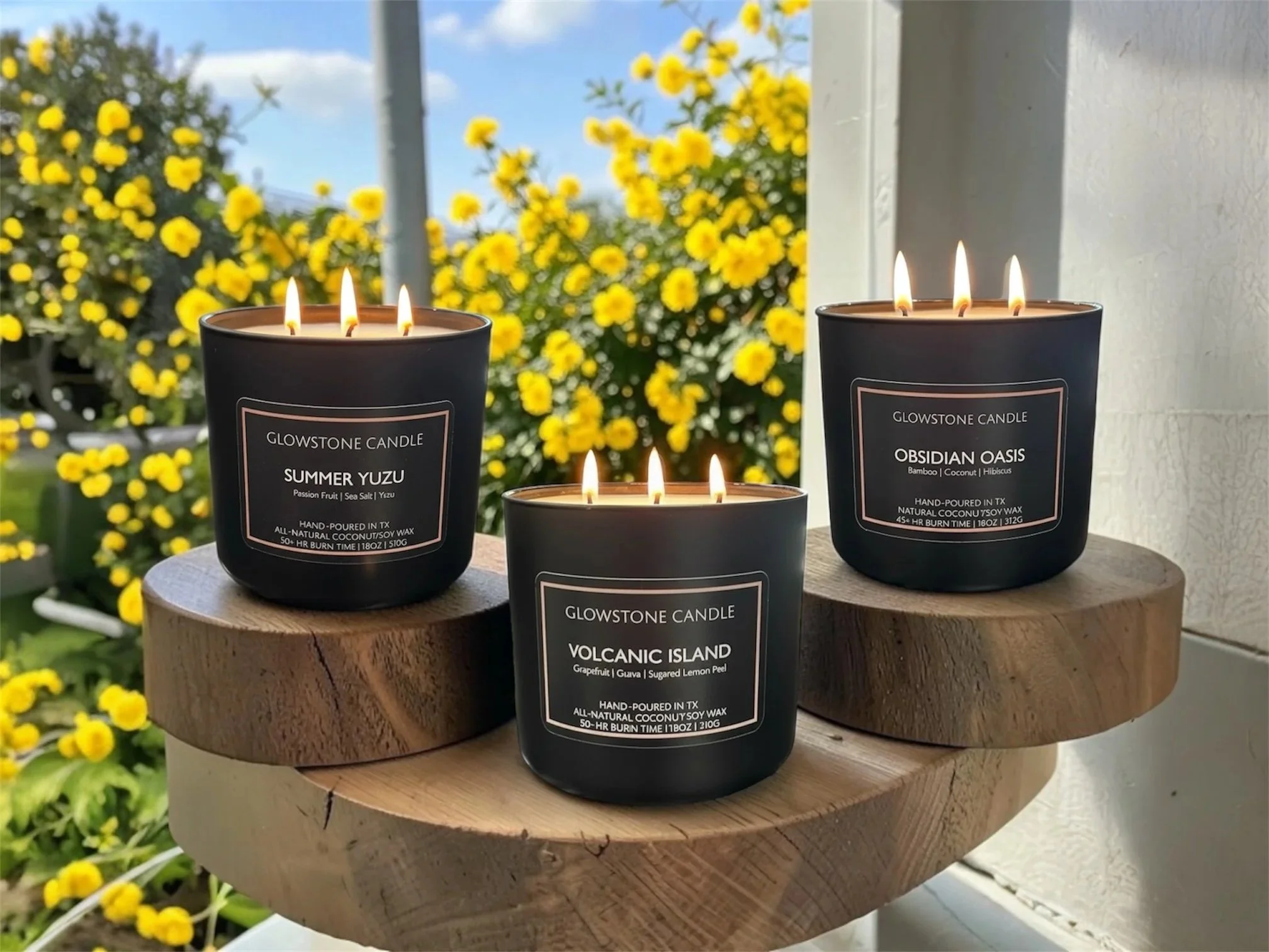 Our new summer collection showing 3 new candles in scents, summer yuzu, obsidian Oasis, and volcanic Island with 3 wicks and 18oz