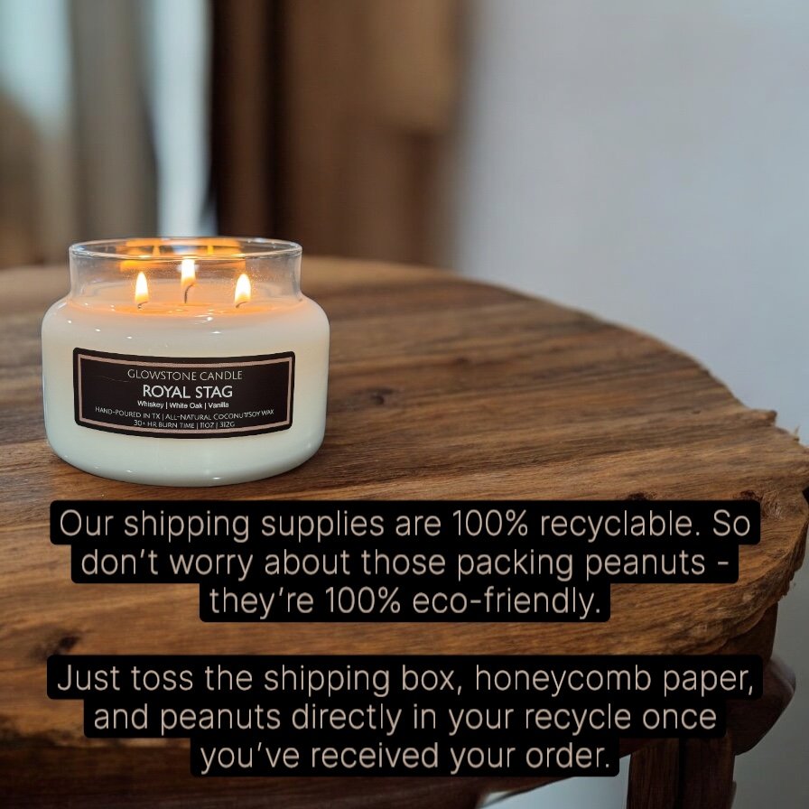A lit white candle labeled 'Glowstone Candle Royal Stag' placed on a wooden surface.
