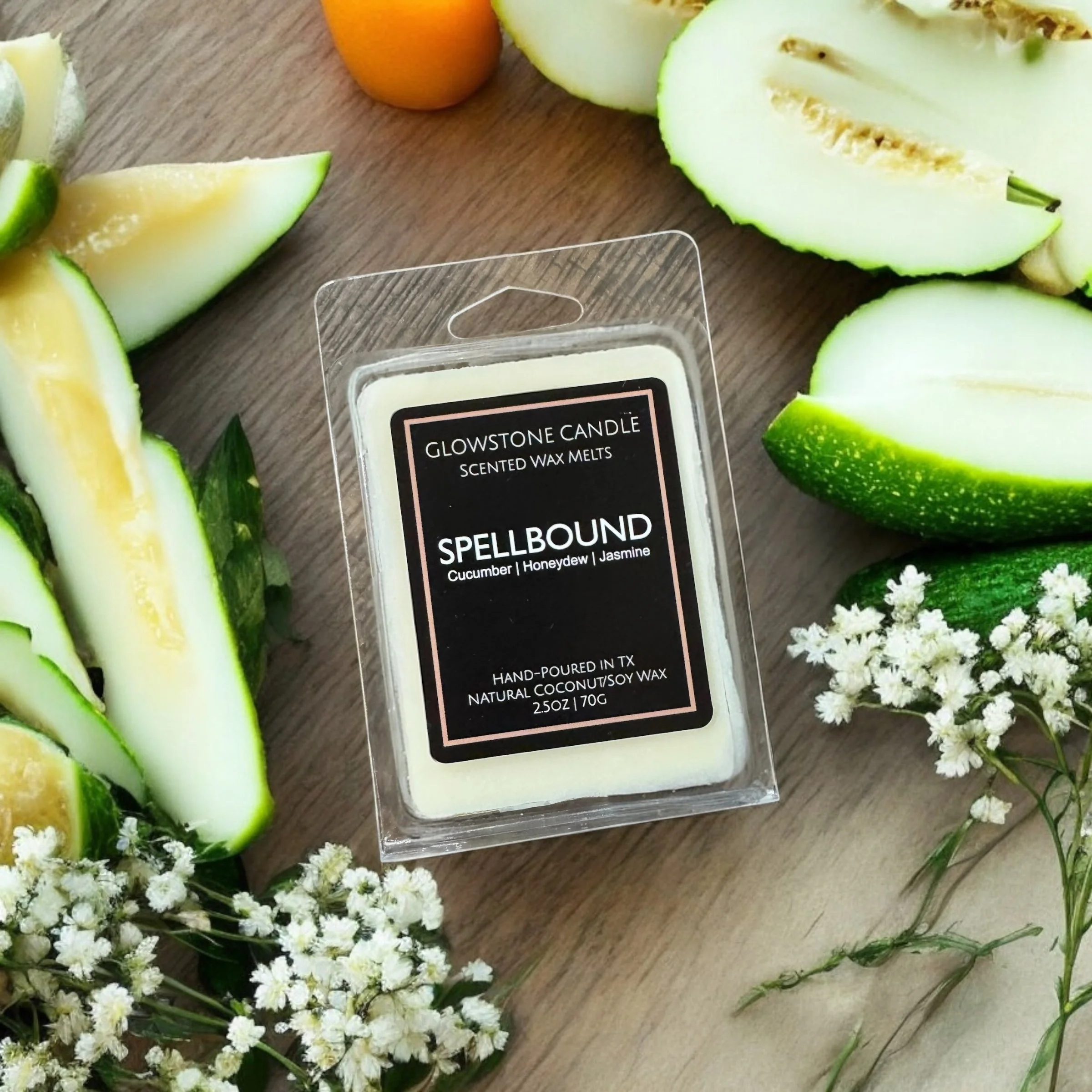 spellbound Wax melt surrounded by cucumbers showing notes of cucumber, honeydew and jasmine