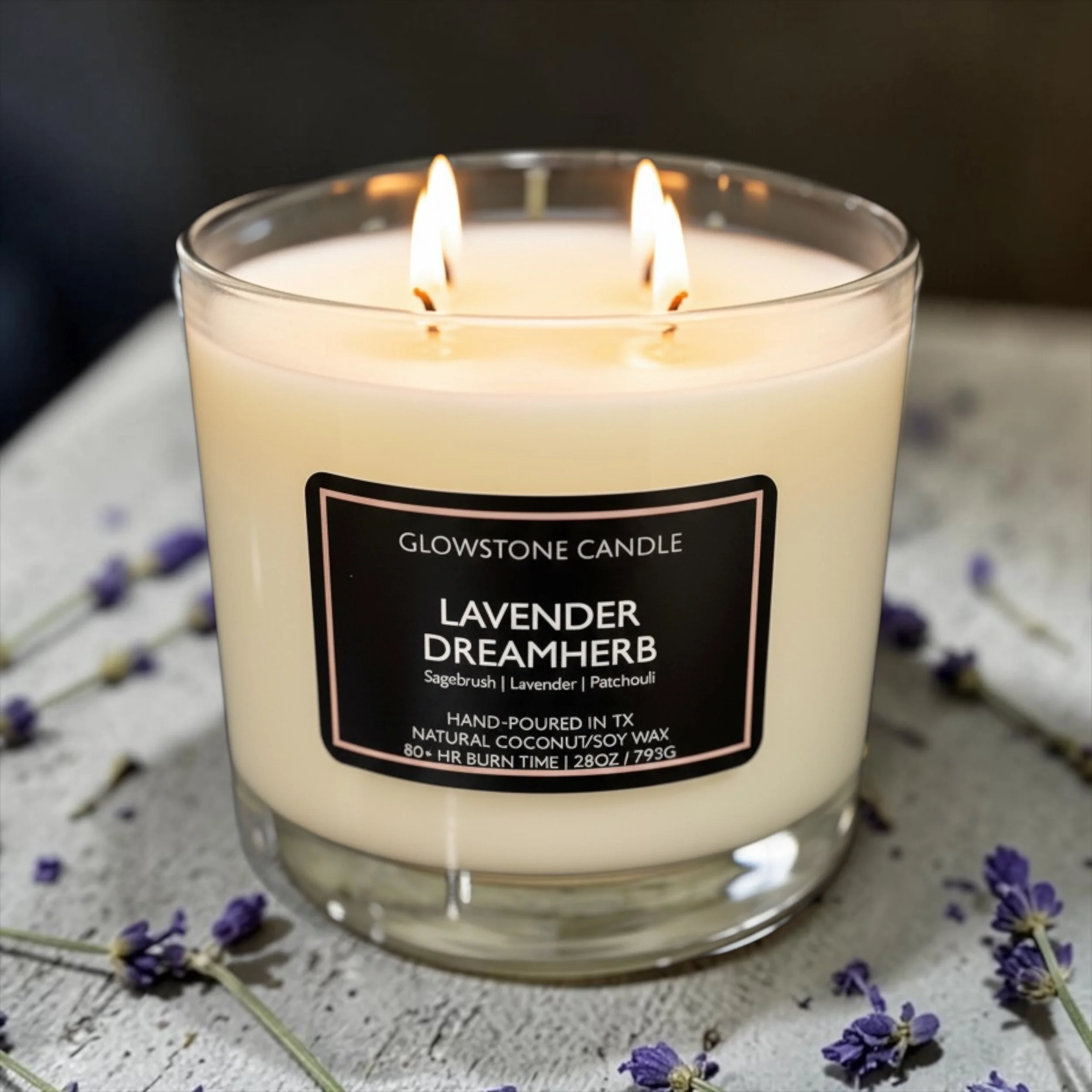 our extra large, 4-wick candle in Lavender Dreamherb with notes of sagebrush, lavender and patchouli in a clear jar with a black label and a burn time of 80-100 hrs
