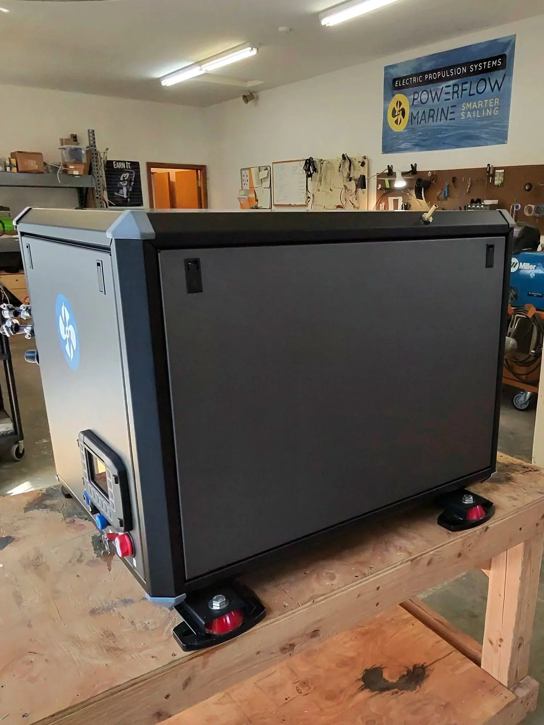 Rear quarter view of the Powerflow Marine 48V DC diesel generator enclosure with service connections
