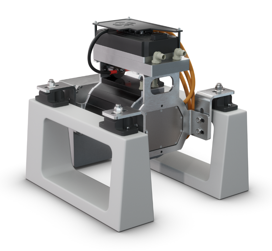 A robotic device mounted on a white stand with various components and wiring.