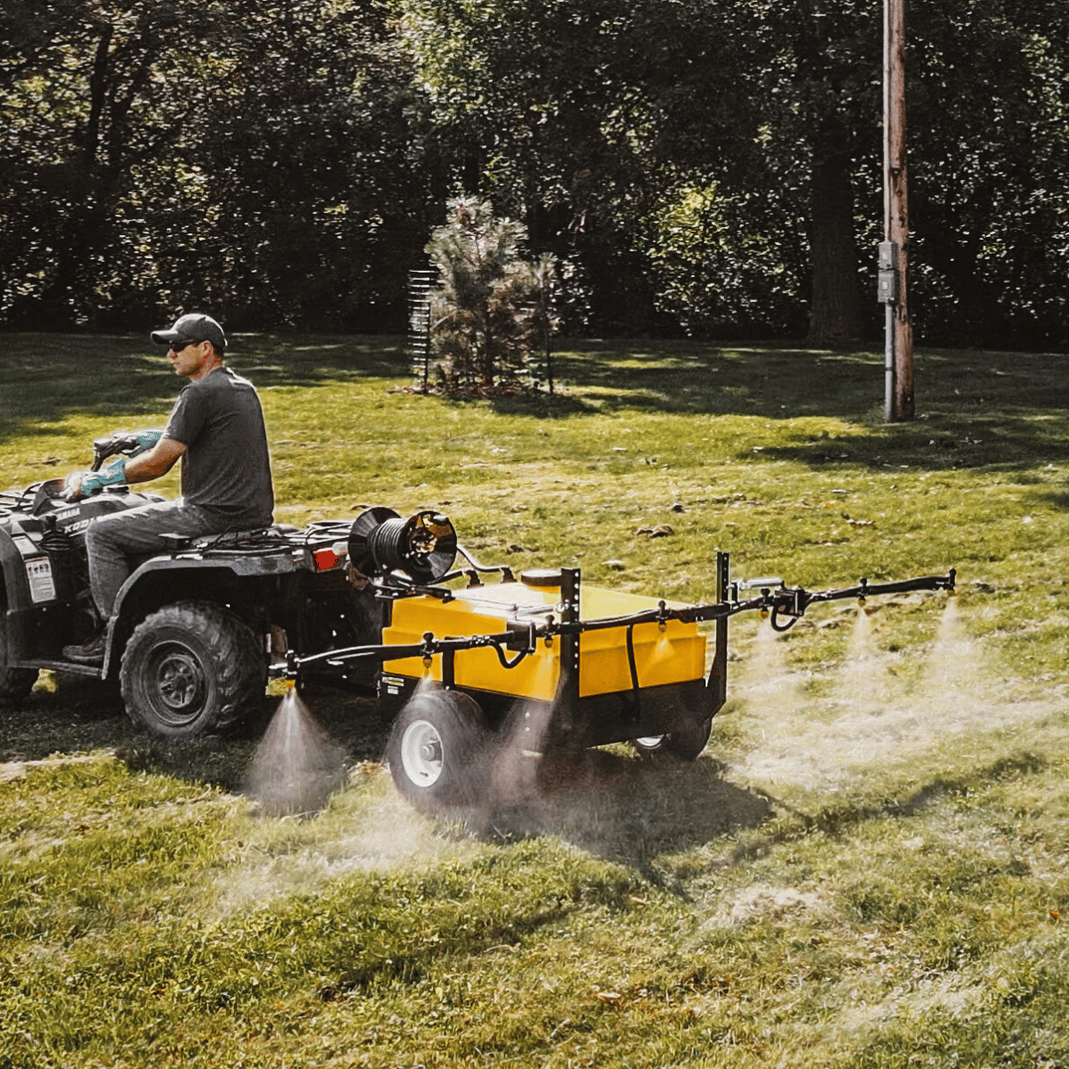 Pull-Behind Mini Sprayer for Alberta acreages, 50' hose reel & wand, perfect for weed control.