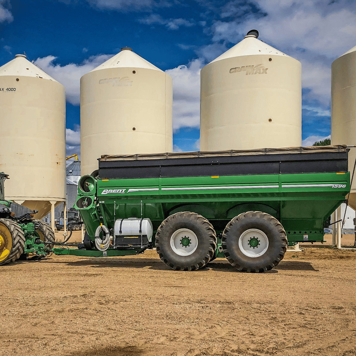 Grain Cart Fire Fighter mounted on the side, 150 gallon, 40' spray reach, 13-min runtime, 205 PHS transfer pump, in Alberta.