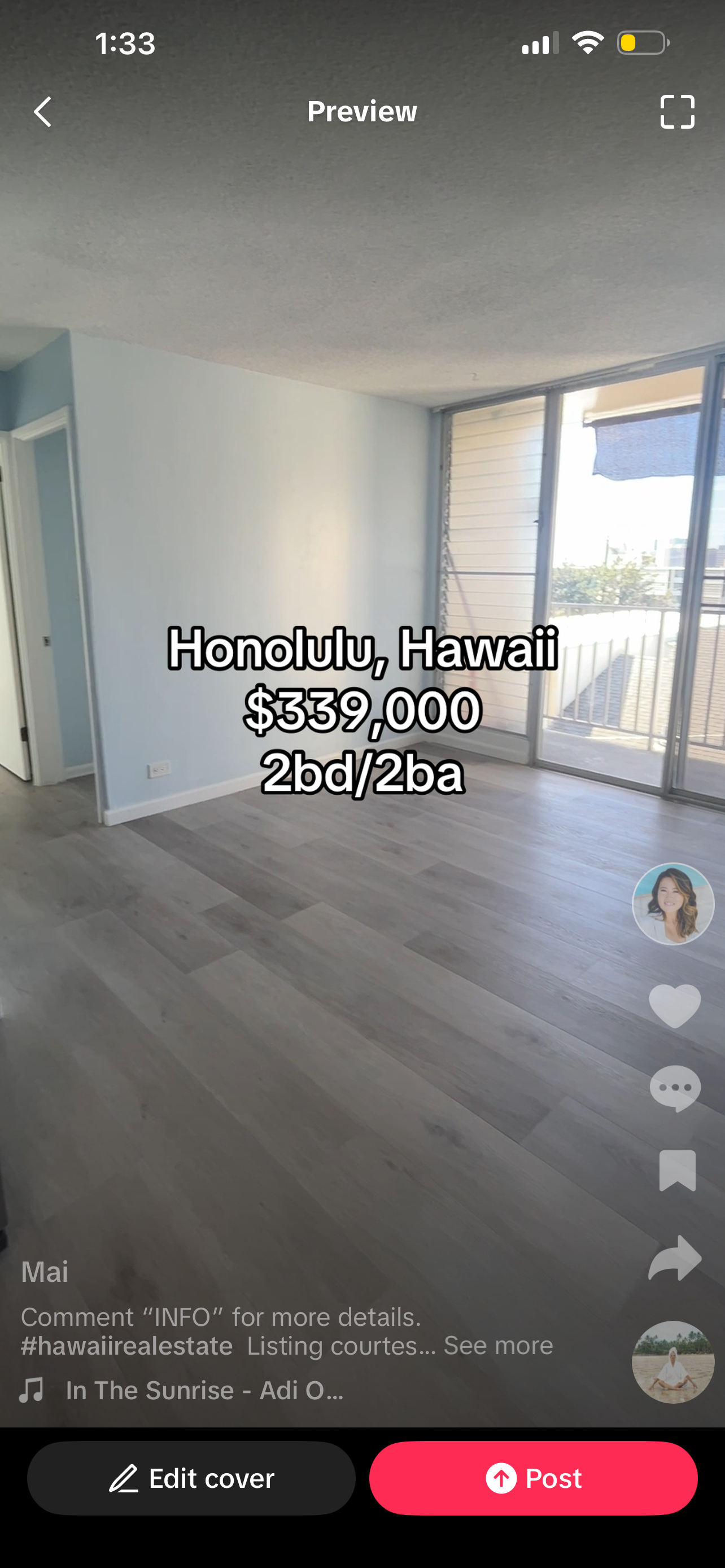 Empty living room with light wooden floors, white walls, sliding glass door leading to a balcony, and visible neighboring building outside.