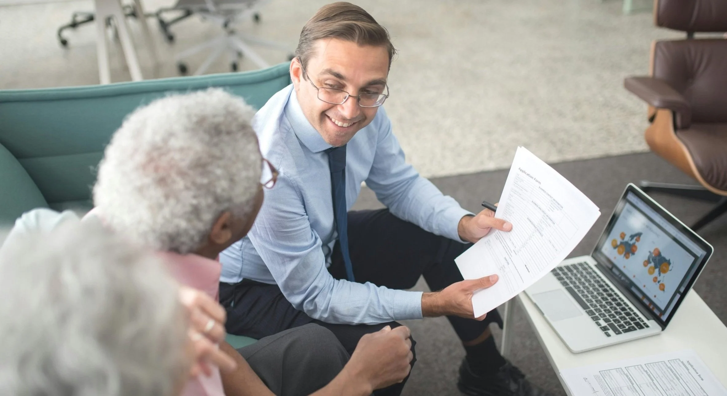 image showing wealth advisor advising clients about retirement