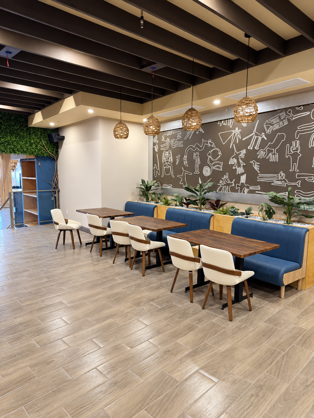 El Ajicito restaurant interior with blue banquette seating and wood tables — BAWI project