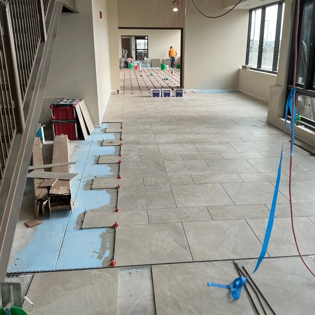 Exciting progress! Tile is going in between the main entrance and the emergency entrance, pharmacy cabinets and shelves are installed, and landscaping is underway!