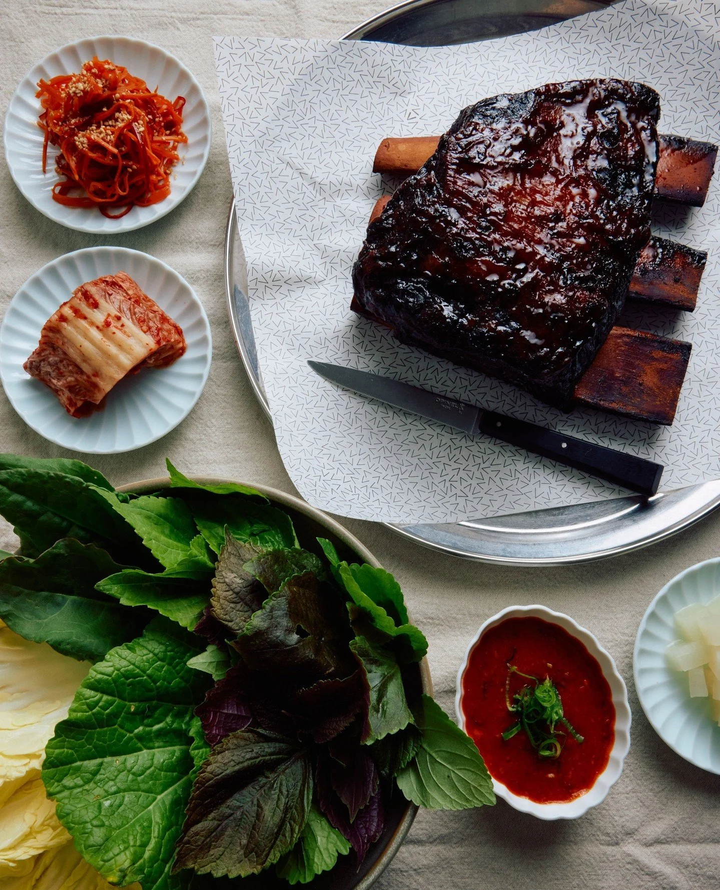 Our take on one of Seoul's favourite feasts, Bo Ssam, is a special addition to our menu that's best shared with friends and family.⁠
⁠
For this, we slow-roast Wagyu beef short rib, ready to pile into soft herbs, house ferments and preserves.⁠
⁠
Avail