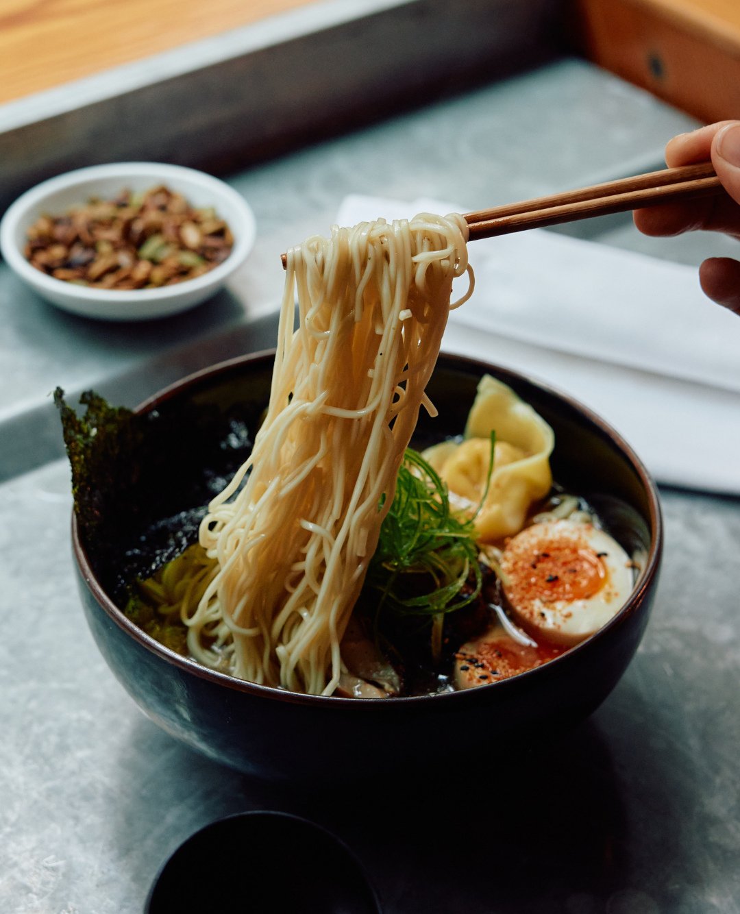 Ramen for weekday lunch. Warming broth is poured over tender noodles and topped with grilled chicken, prawn &amp; chicken dumplings, and a soy-marinated egg. ⁠
⁠
Available weekdays from midday until sold out. ⁠
⁠