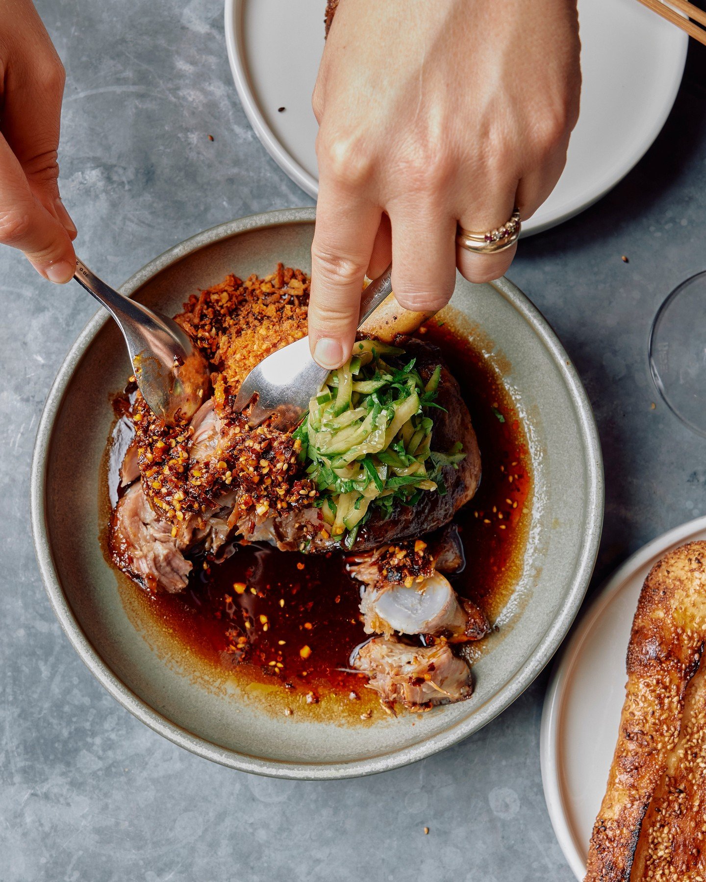 Slow-cooked Szechuan lamb shoulder, black vinegar, pickled cucumber, fragrant chill