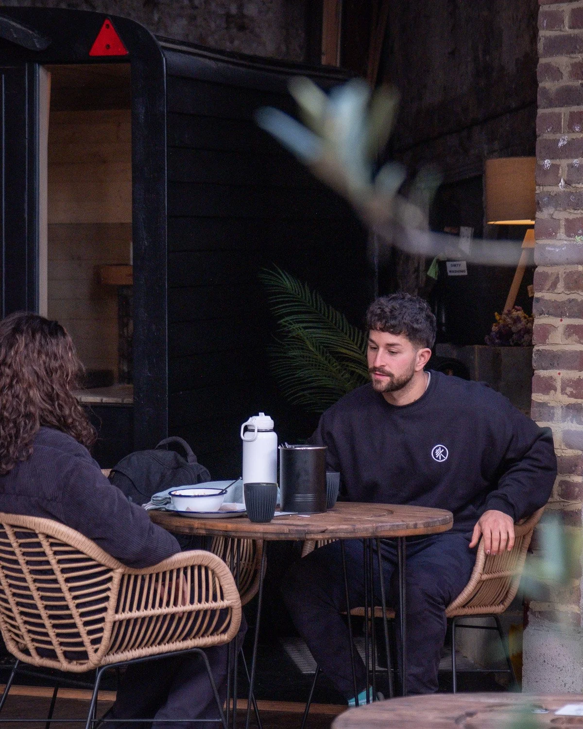 Open air seating with courtyard garden vibes.