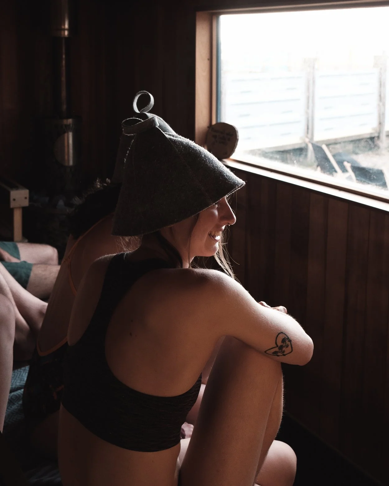 Promotional sign for heat wave sauna offer with three thermometer icons, listing discounts and prices in British pounds.