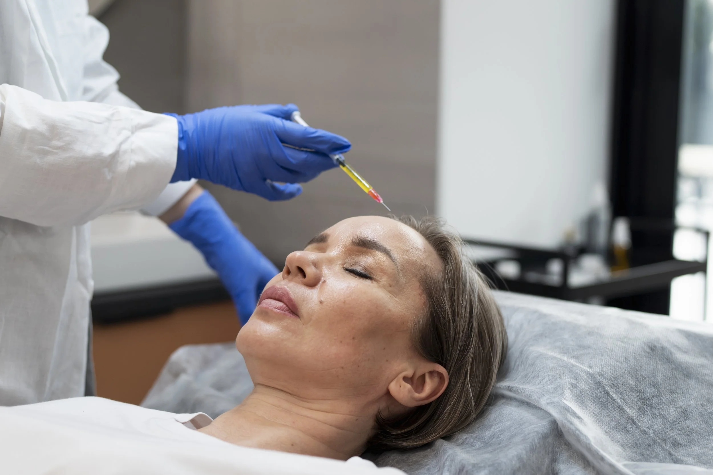 high-angle-woman-getting-prp-treatment.jpg