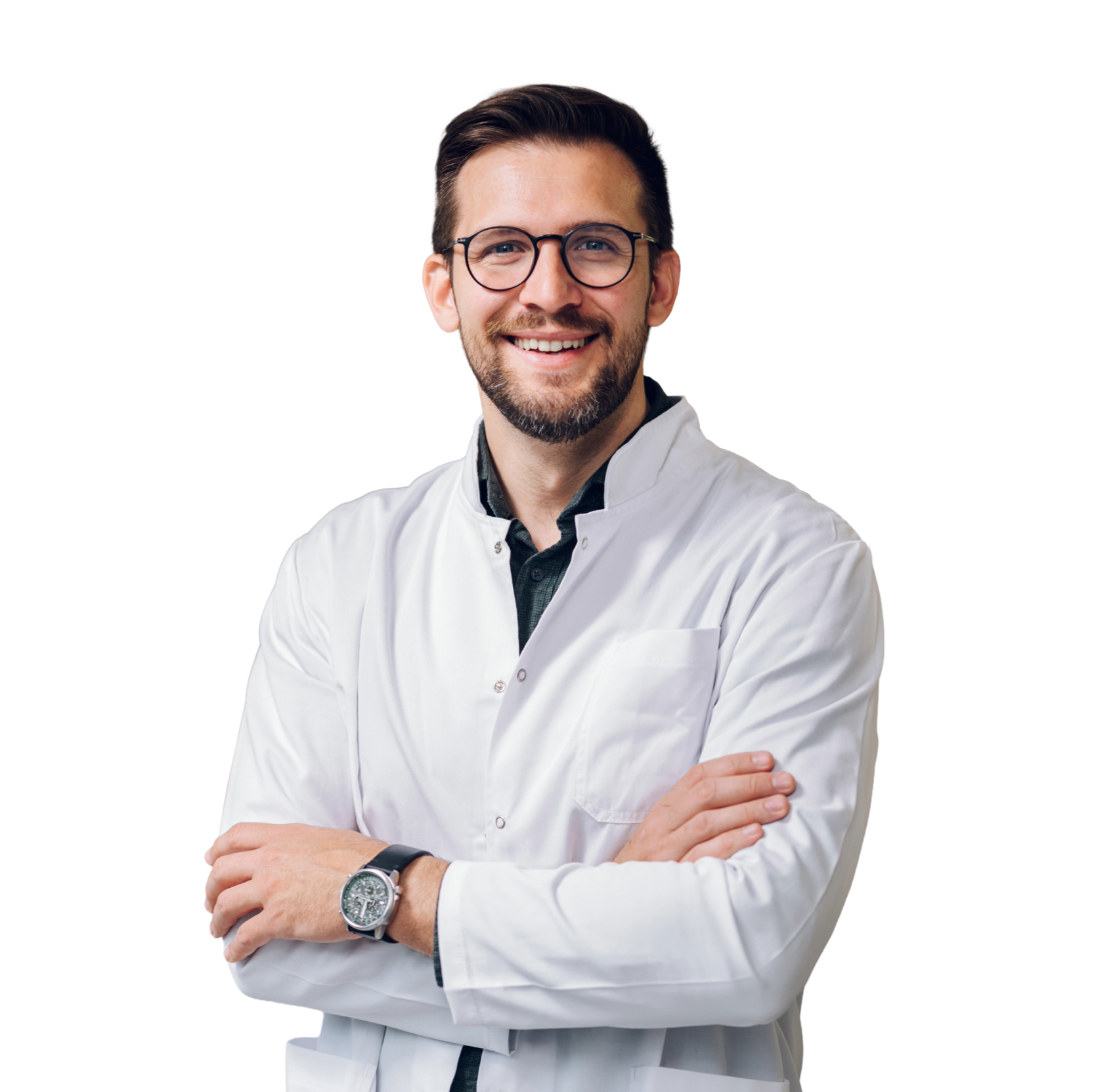 A smiling male doctor with brown hair and glasses wearing a white lab coat with arms crossed.