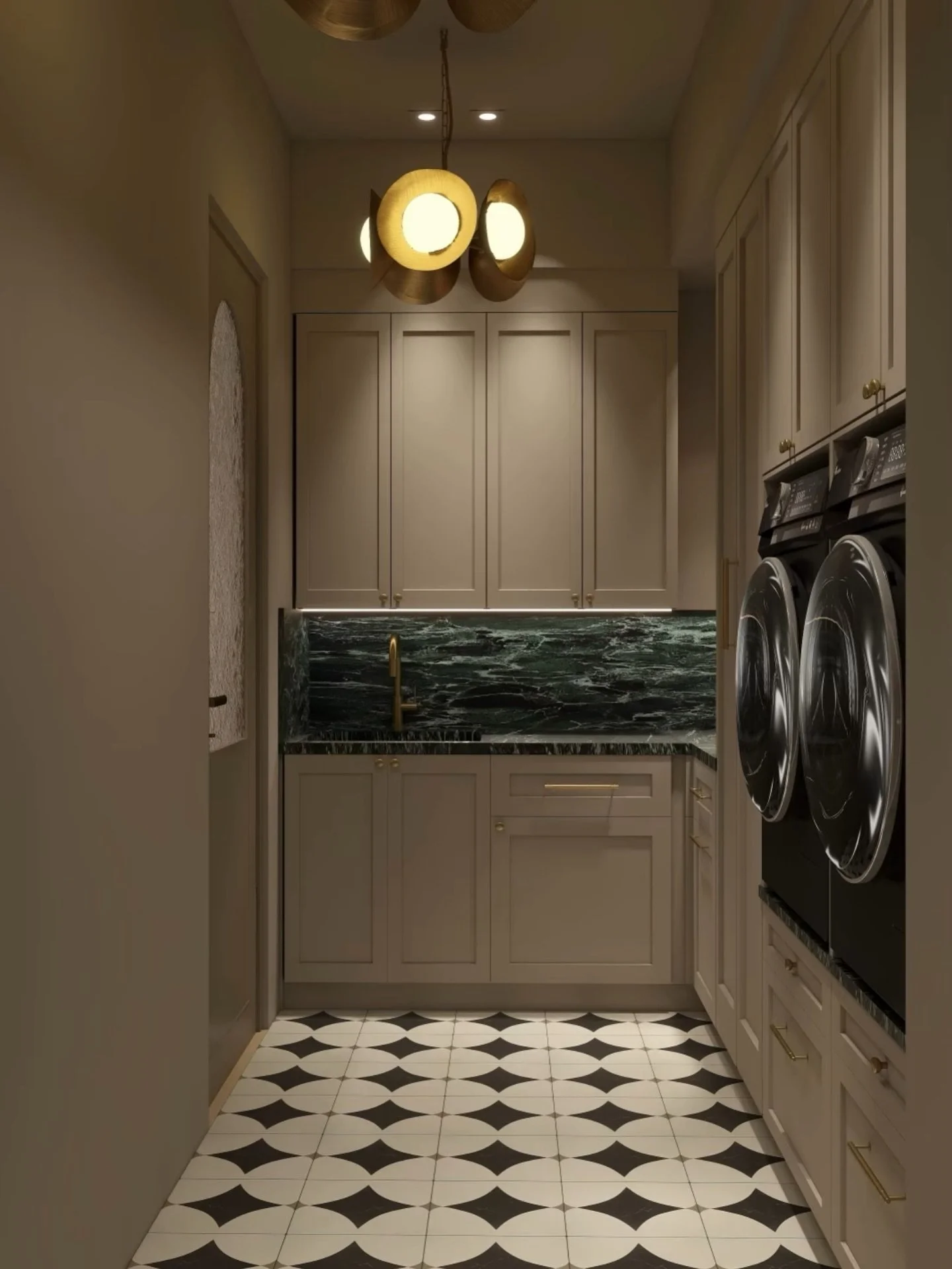 Proof that even the most functional spaces deserve beautiful design.

This laundry room balances utility with intention, from the graphic tile underfoot to the layered lighting and rich stone details. Thoughtful choices turn an everyday space into on