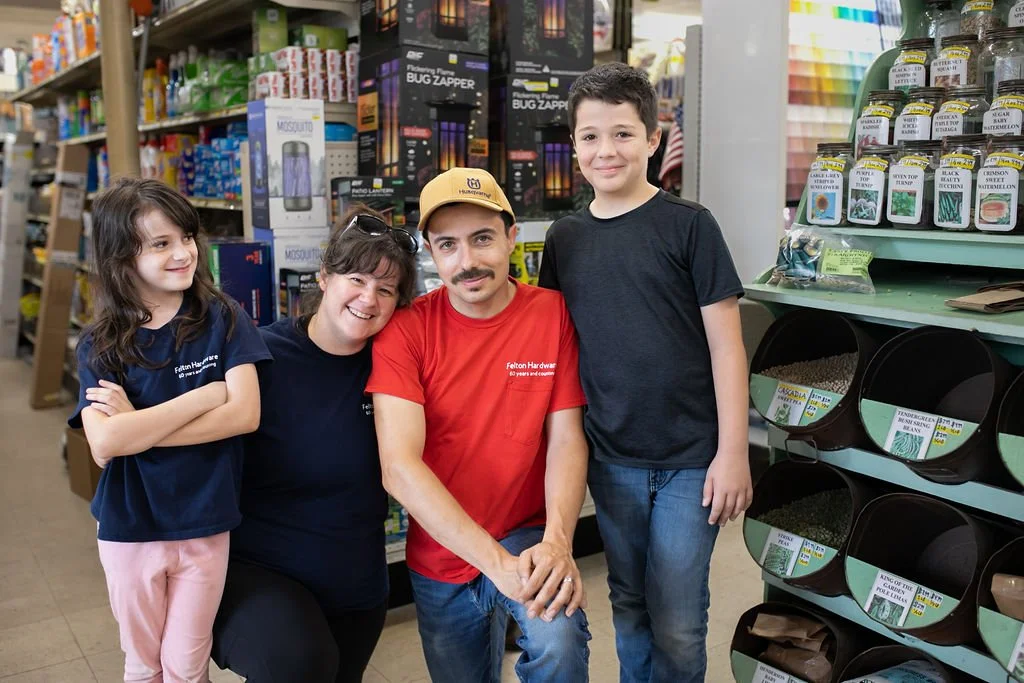 Alex and Kate Donovan with their children inside Felton Hardware, representing the next generation of the family business