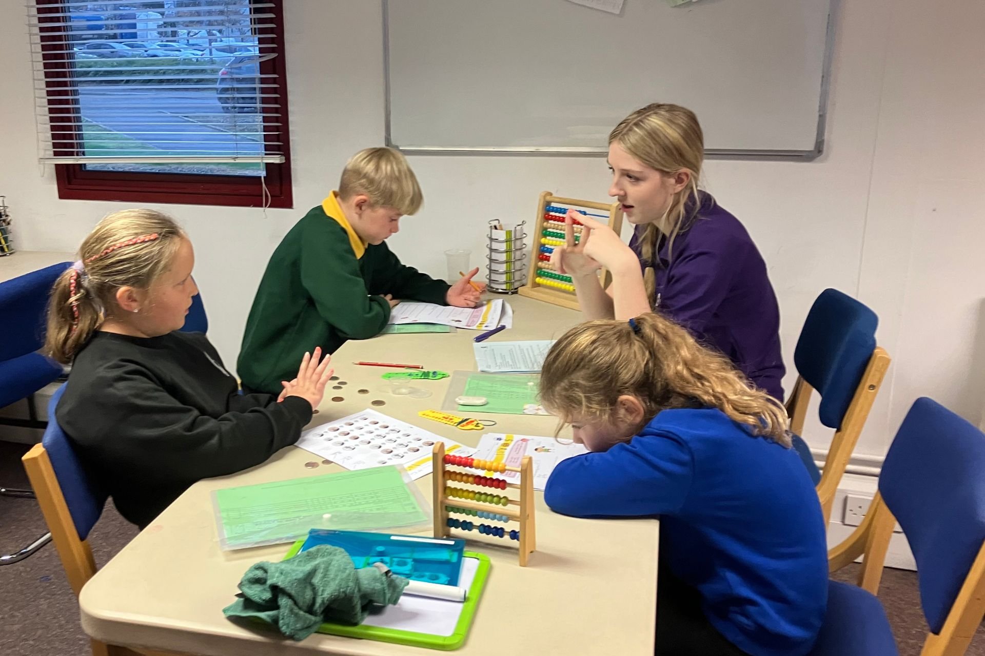 How does small group tuition help children at school?