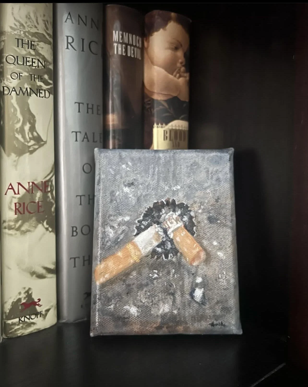 bottle cap ash tray on bookshelf.jpg