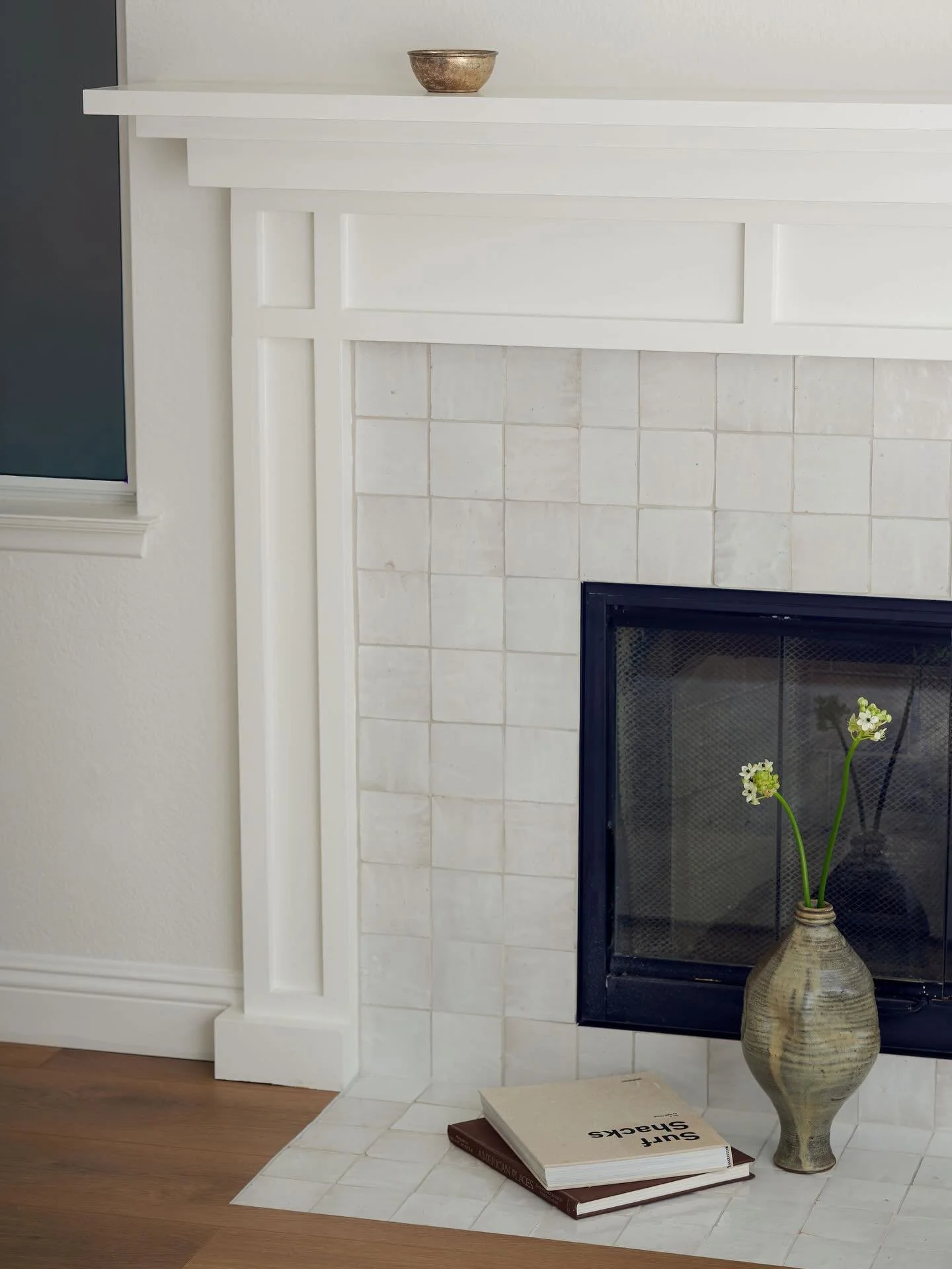 BEFORE &amp; AFTER! 

Swipe to learn more about the process behind this fireplace glow up! My clients liked the style of the fireplace, but wanted to modernize the space. We swapped out the tile with a beautiful Zellige, painted the walls, and replac